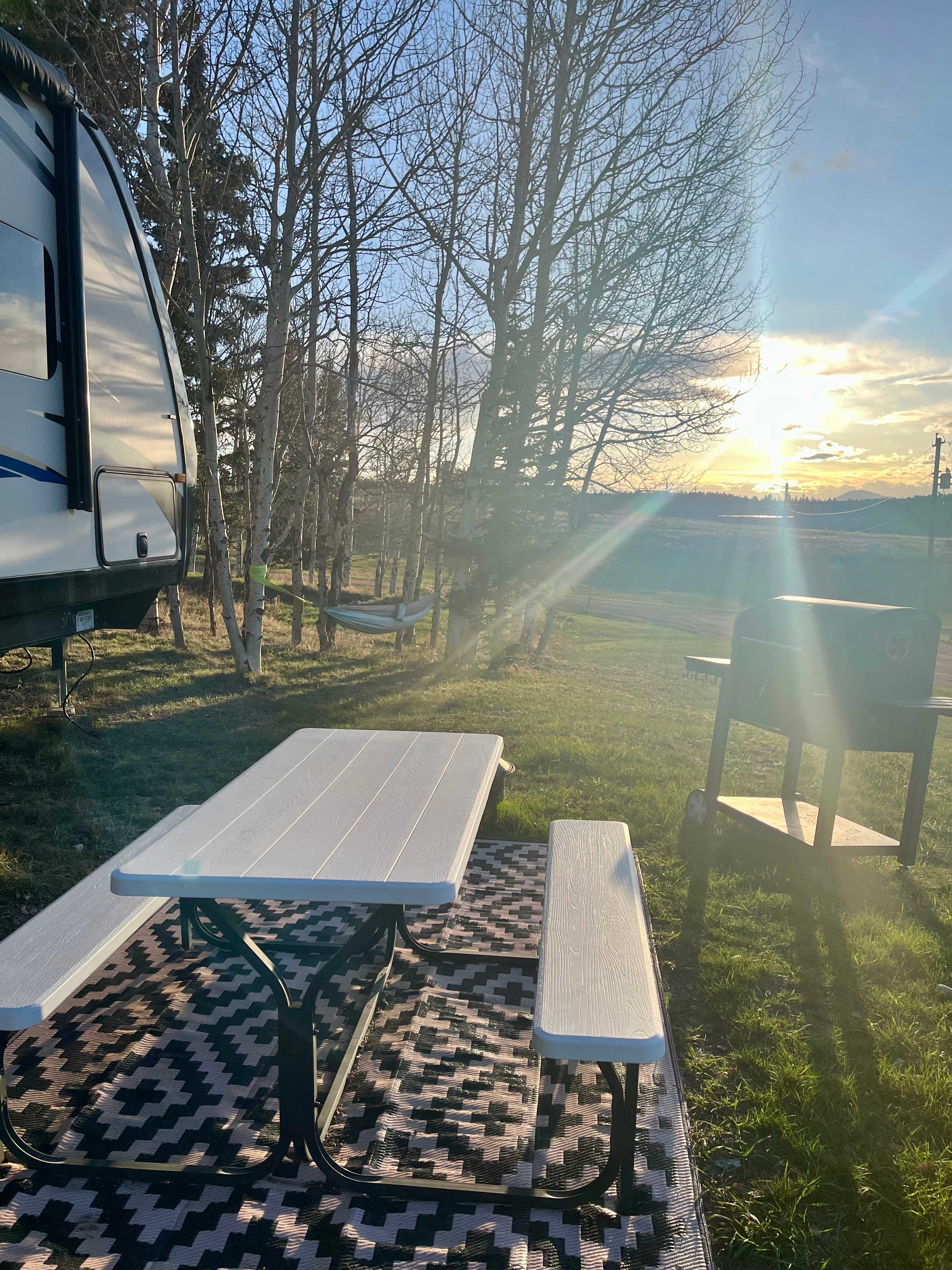 A great place to watch the sunset. Enjoy our picnic table, fire pit, bbq grill and hammock 