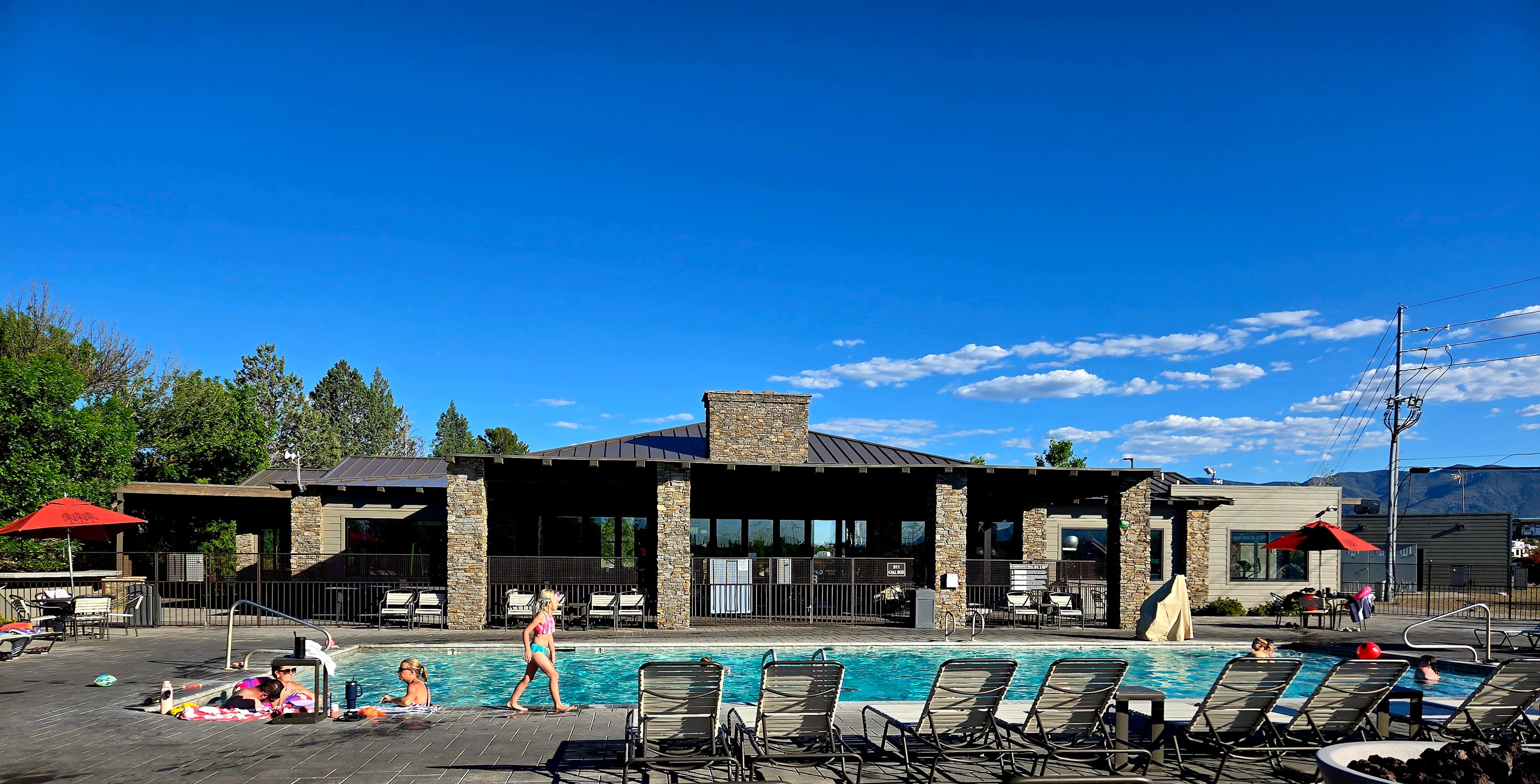 Pool with clubhouse in back