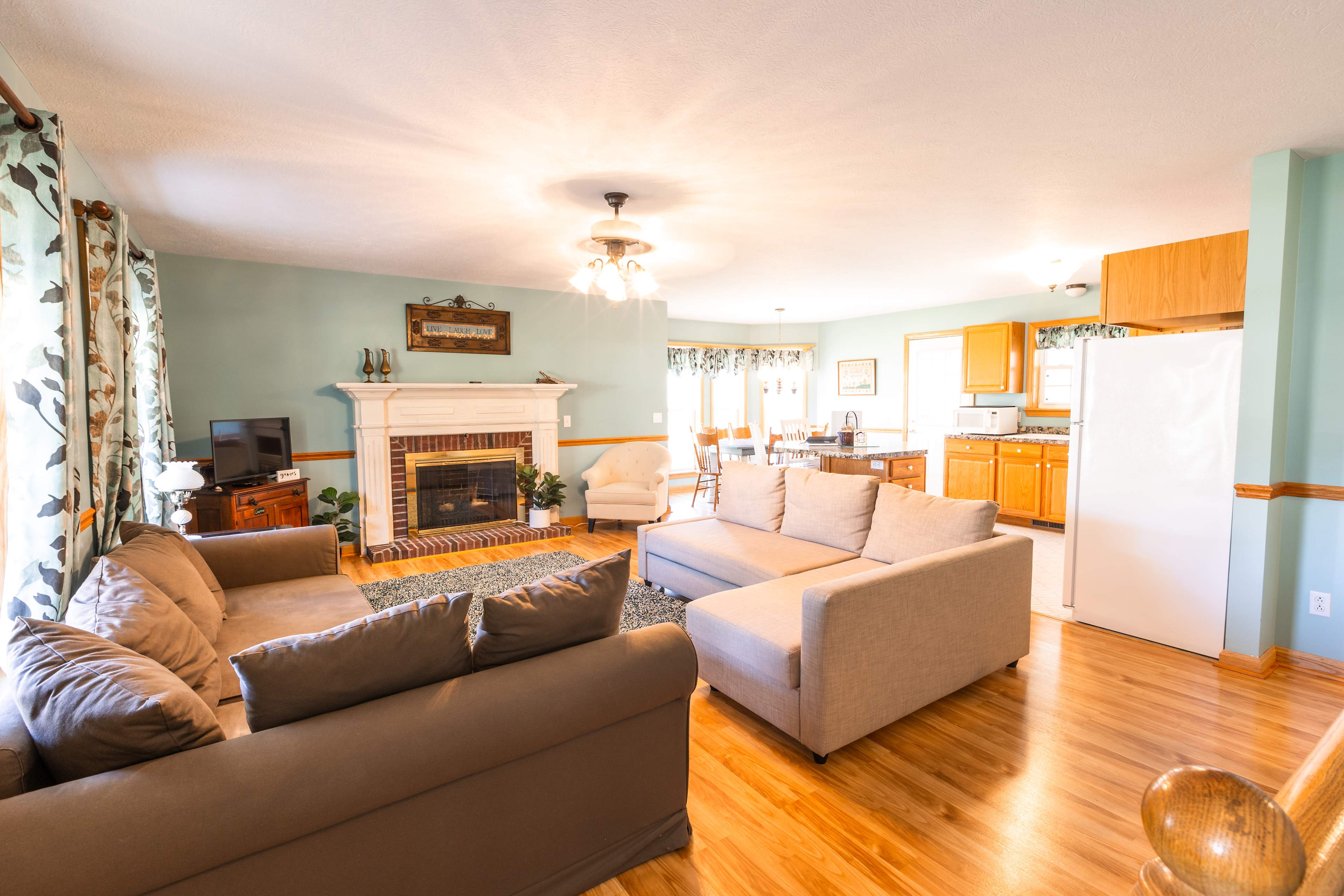 Cozy living room with two queen size pull-out couches and natural light