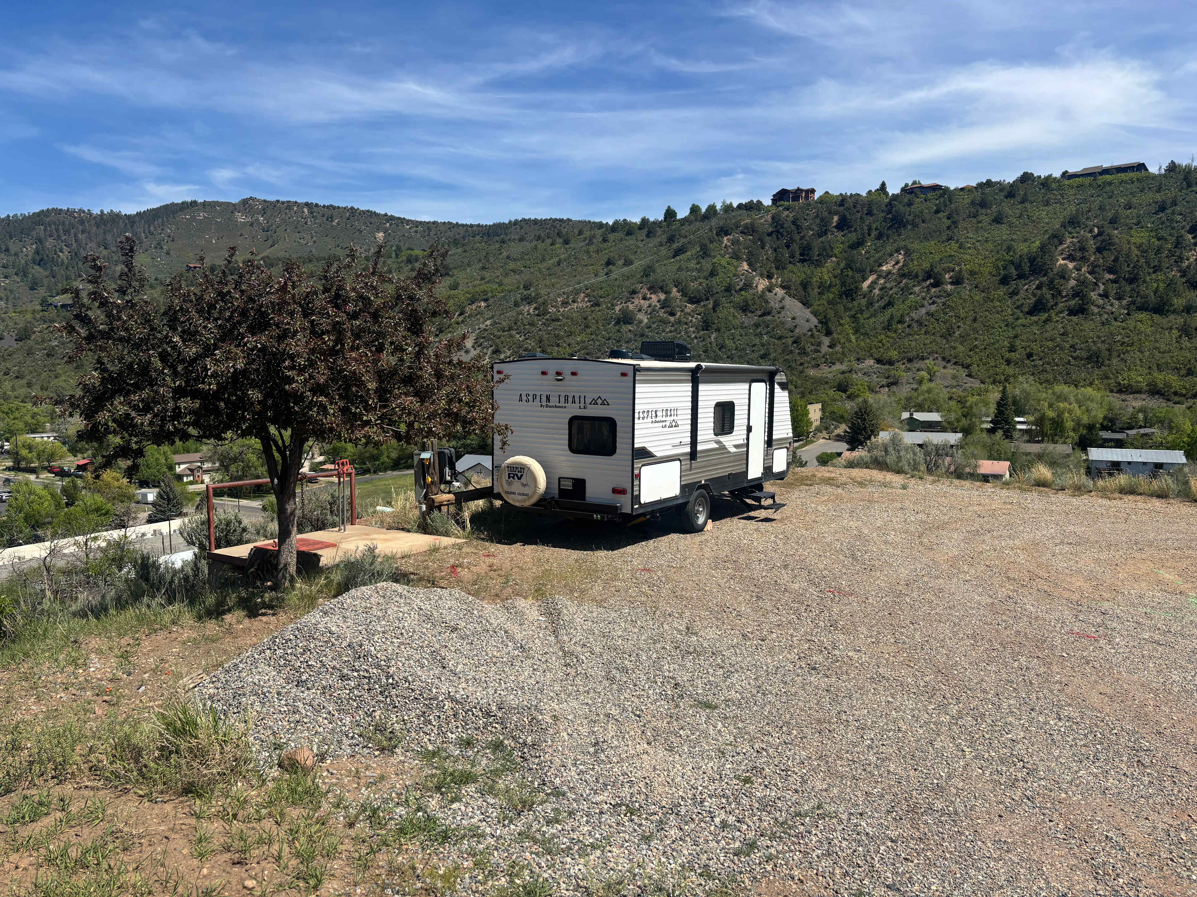 The space on the edge of the hill. Easy access up the driveway but with plenty of distance from the main roads below. 
