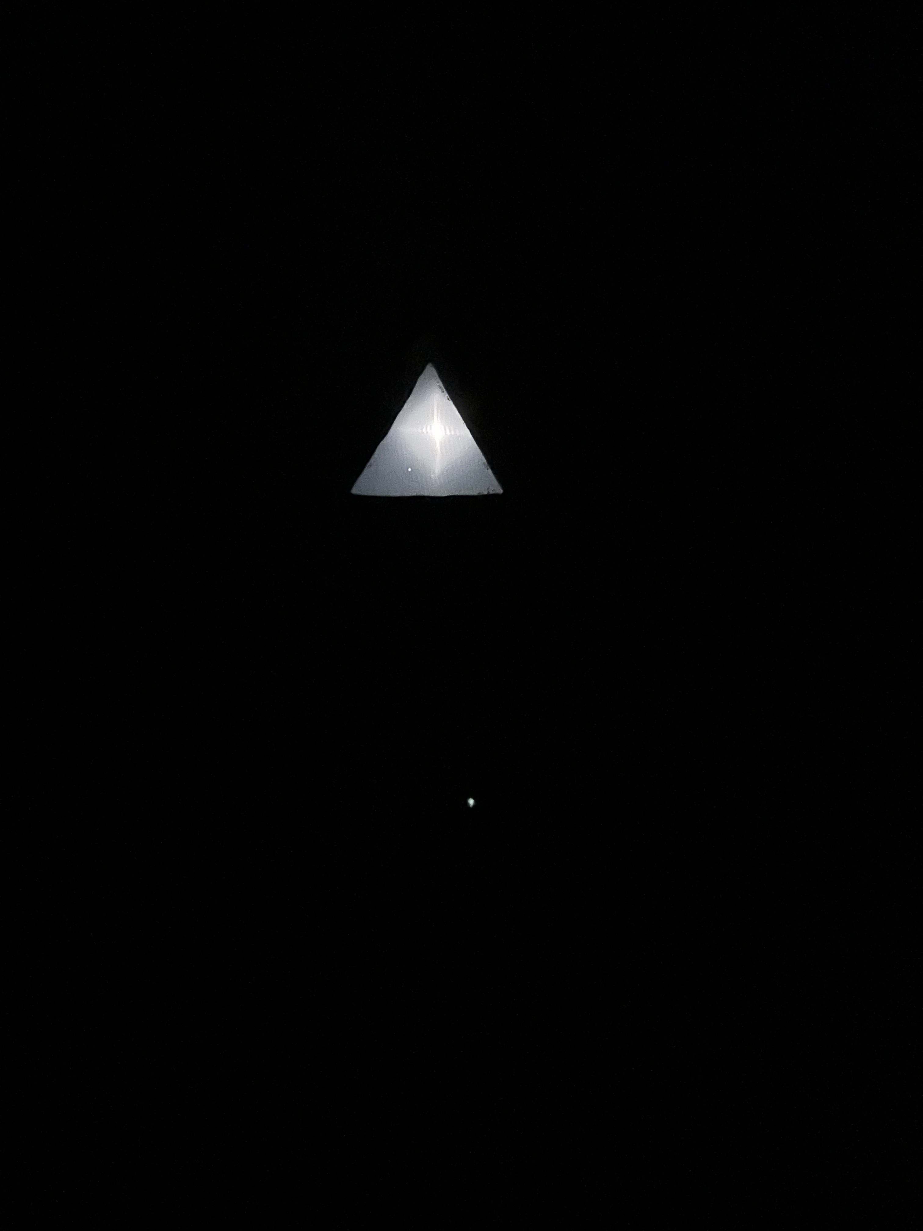 4am view of a thin crescent moon shining on the bed of Casa Huevo. 