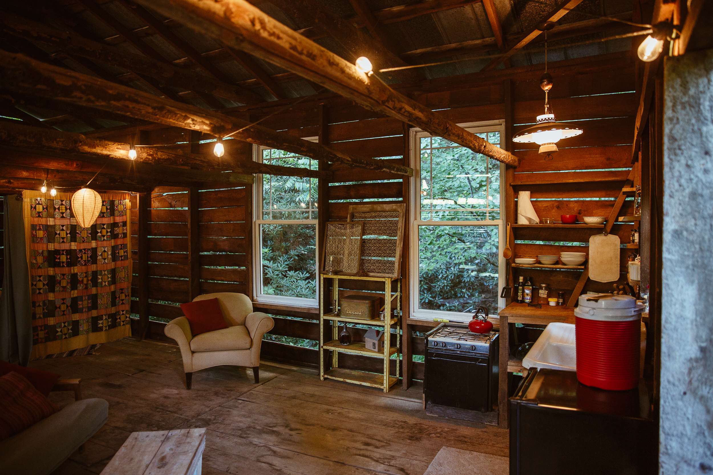 Kitchen & living room with large windows overlooking the creek