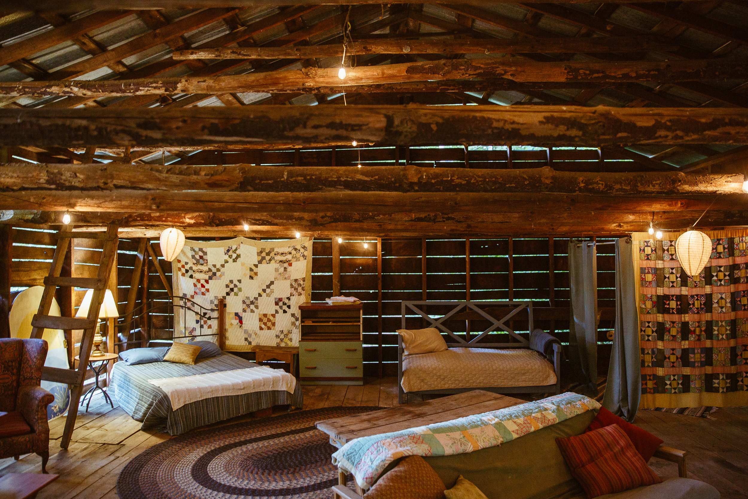 Bedroom area with 1 queen bed and 1 twin bed. Sofa also reclines into a queen bed.