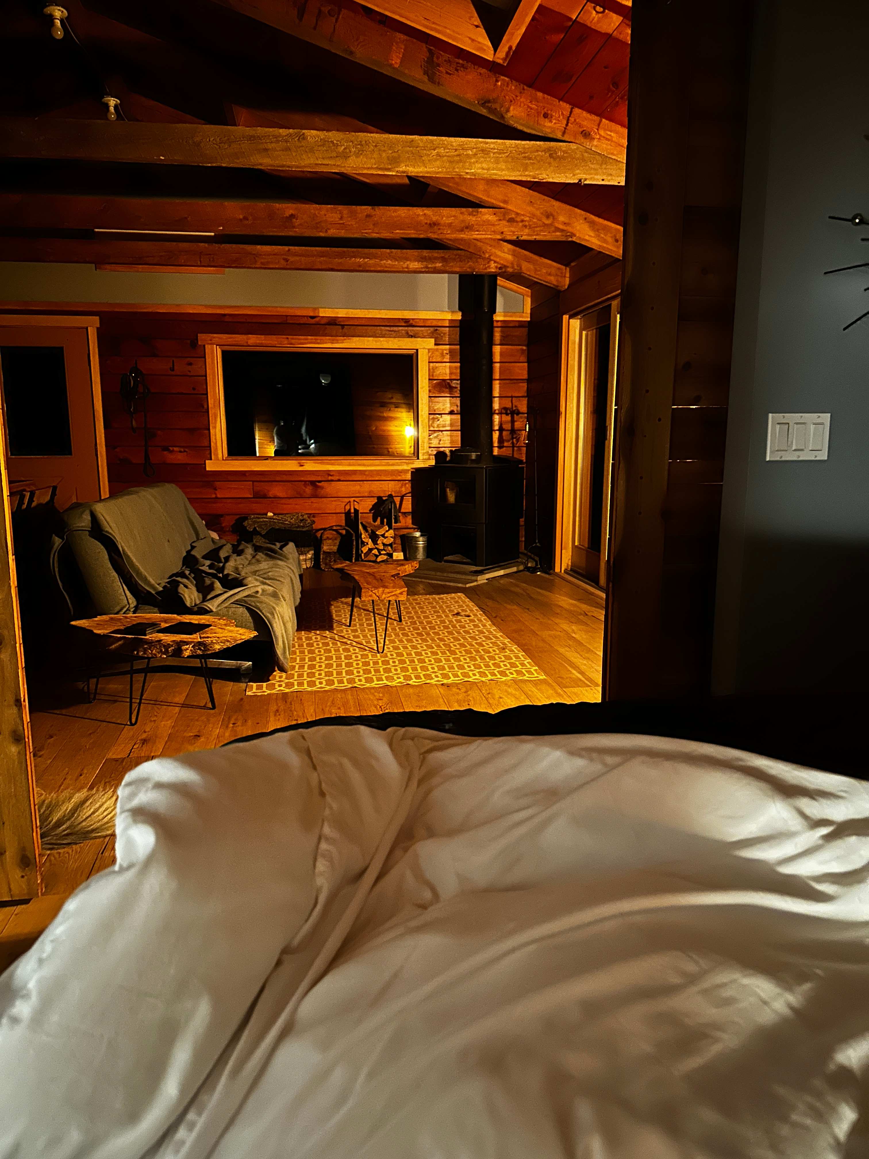Cozy view from the bed at night. 