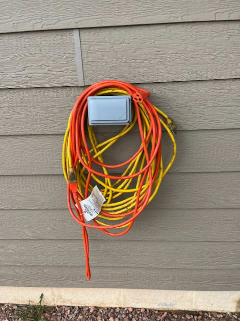 20 amp outlet available with provided extension cord on side of garage
