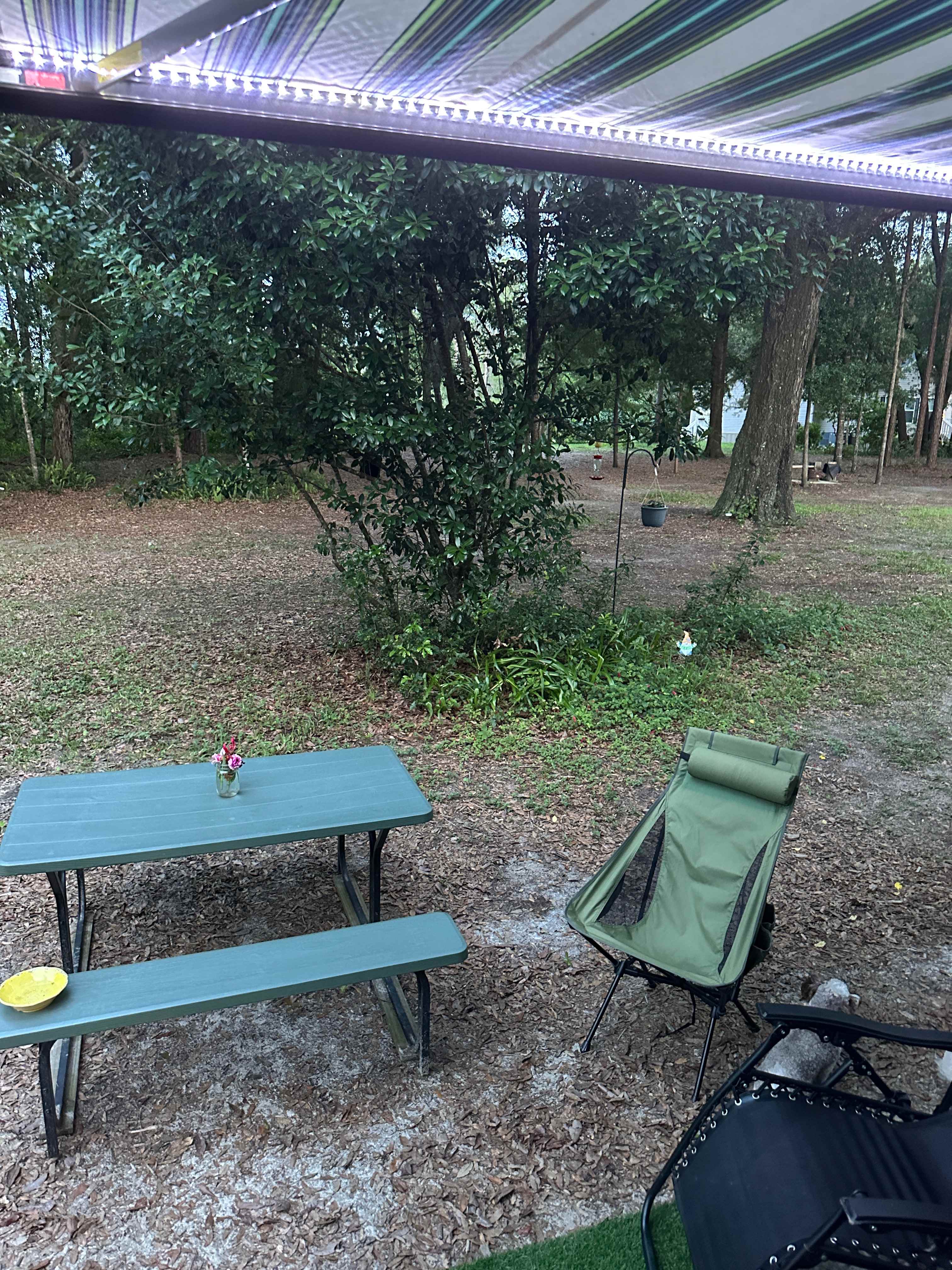 Campsite picnic table with fresh flowers from Peggy