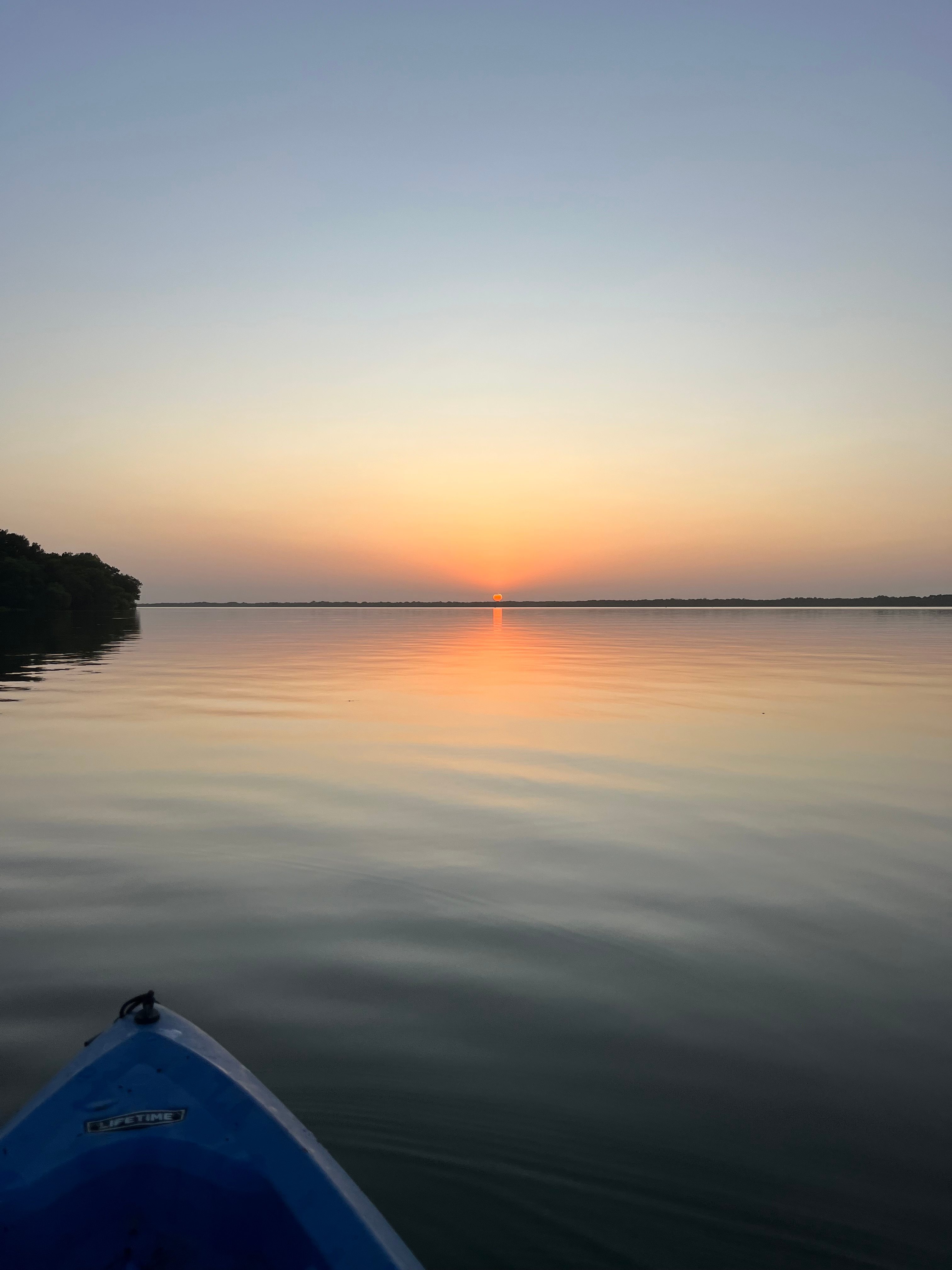 Sunset over the lake by kayak