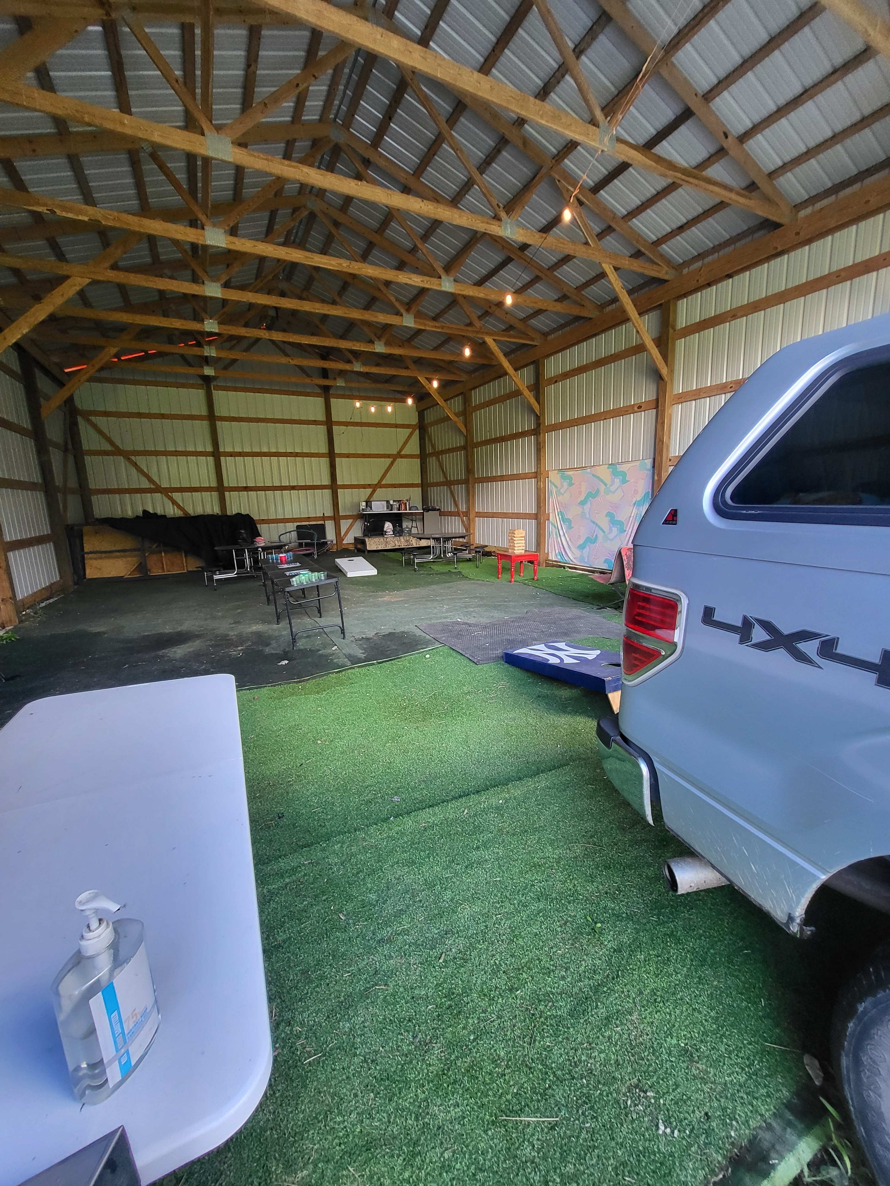 Inside the barn was games and tables and chairs 