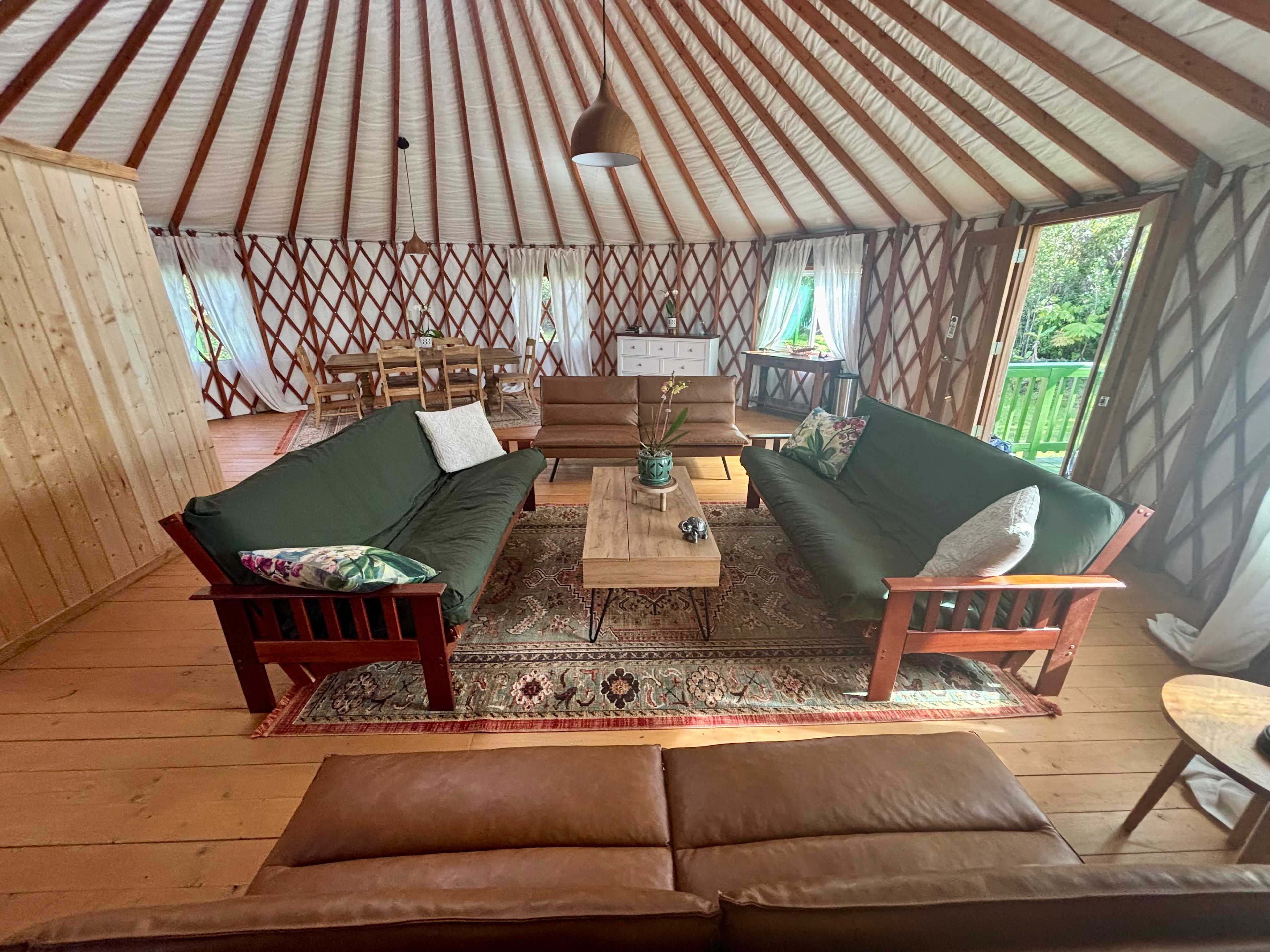 View of the sleeping area from the back of one of the four futon couches. Lots of space to move around.