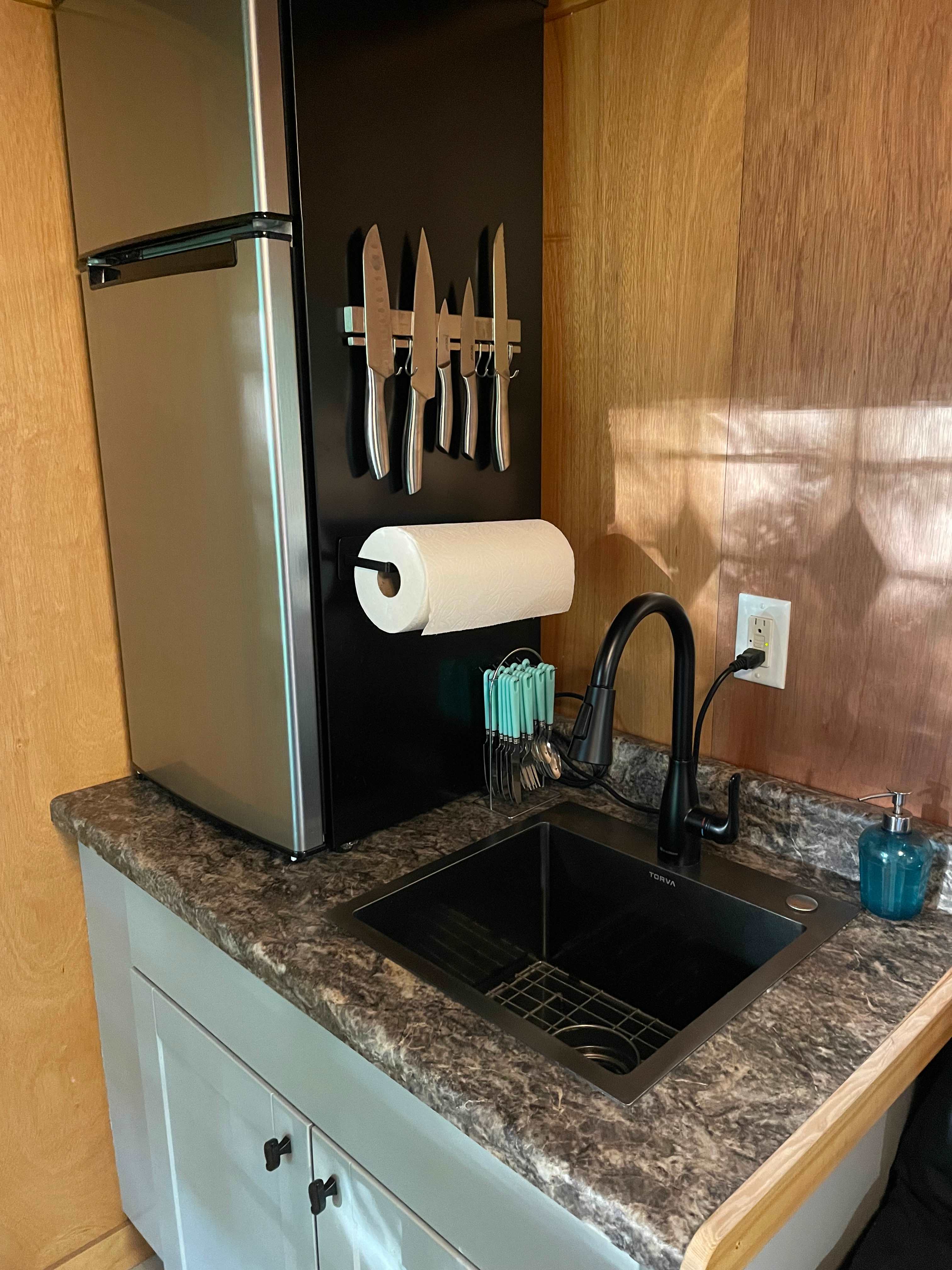 Fridge, paper towels, sharp knives, soap, hand/dish towels.