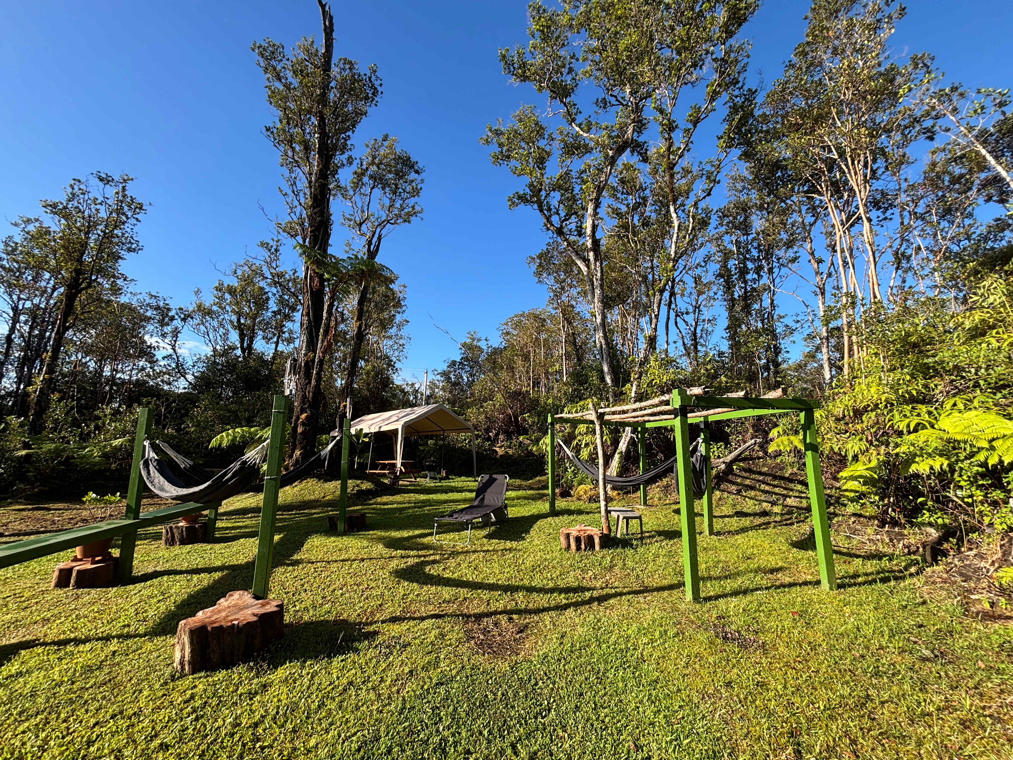 Hammock and BBQ area. There are four hammocks and four sun bed loungers.