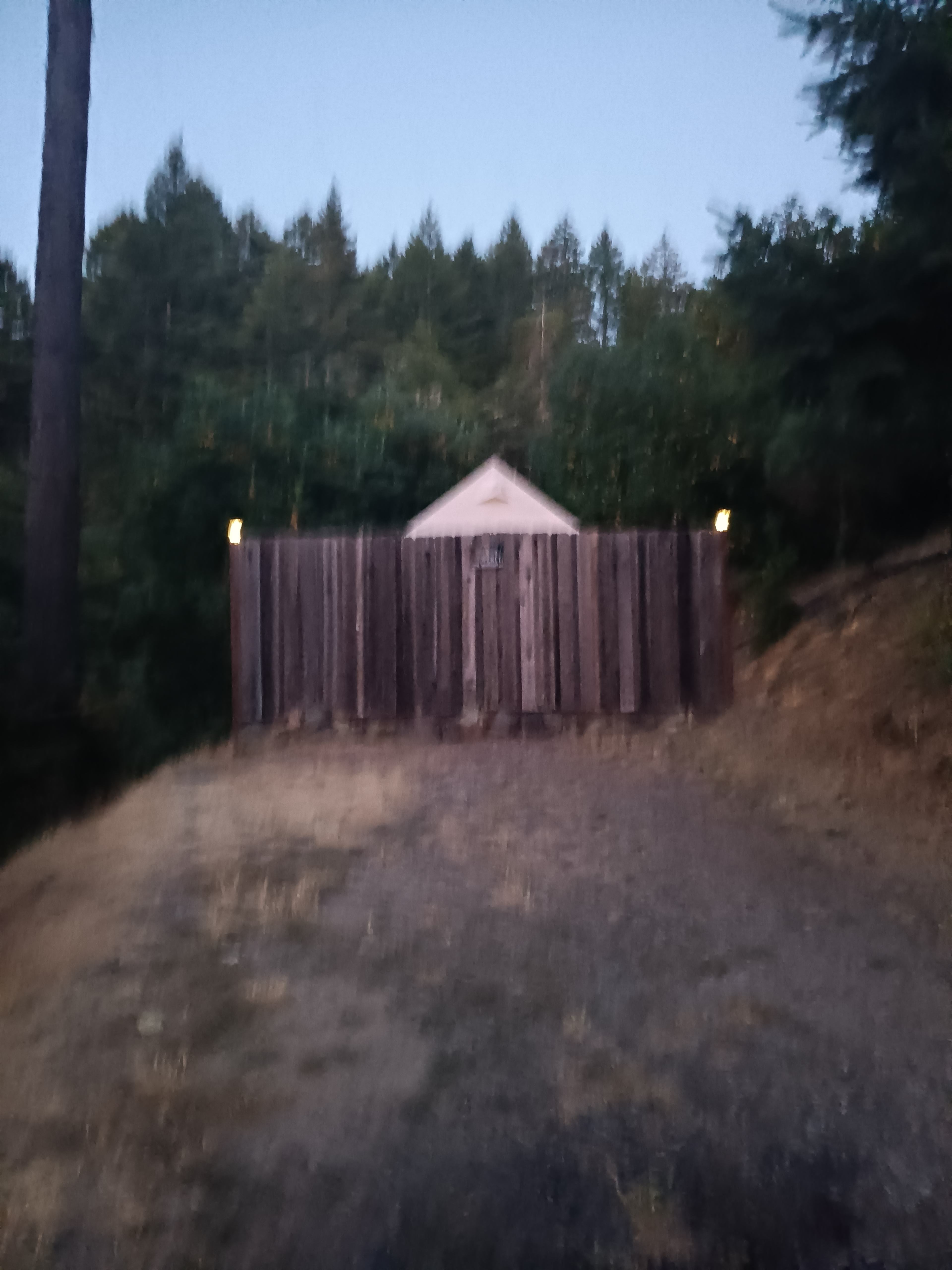 Star View at dusk. Pull right up to the wood fence and park directly in front of your tent. 