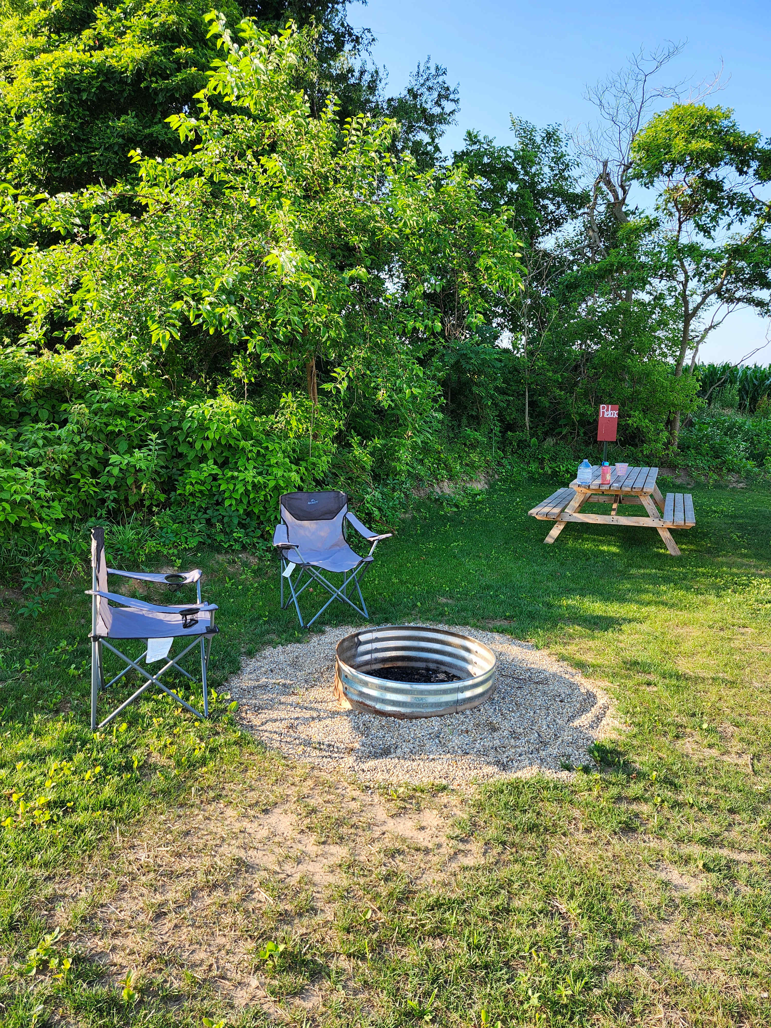 Outdoor living area. Two folding chairs to use by the fire, and one bundle of wood were included. Extra wood was nearby and could be purchased for $5/bundle. GREAT birdwatching, saw/heard close to 20 species.