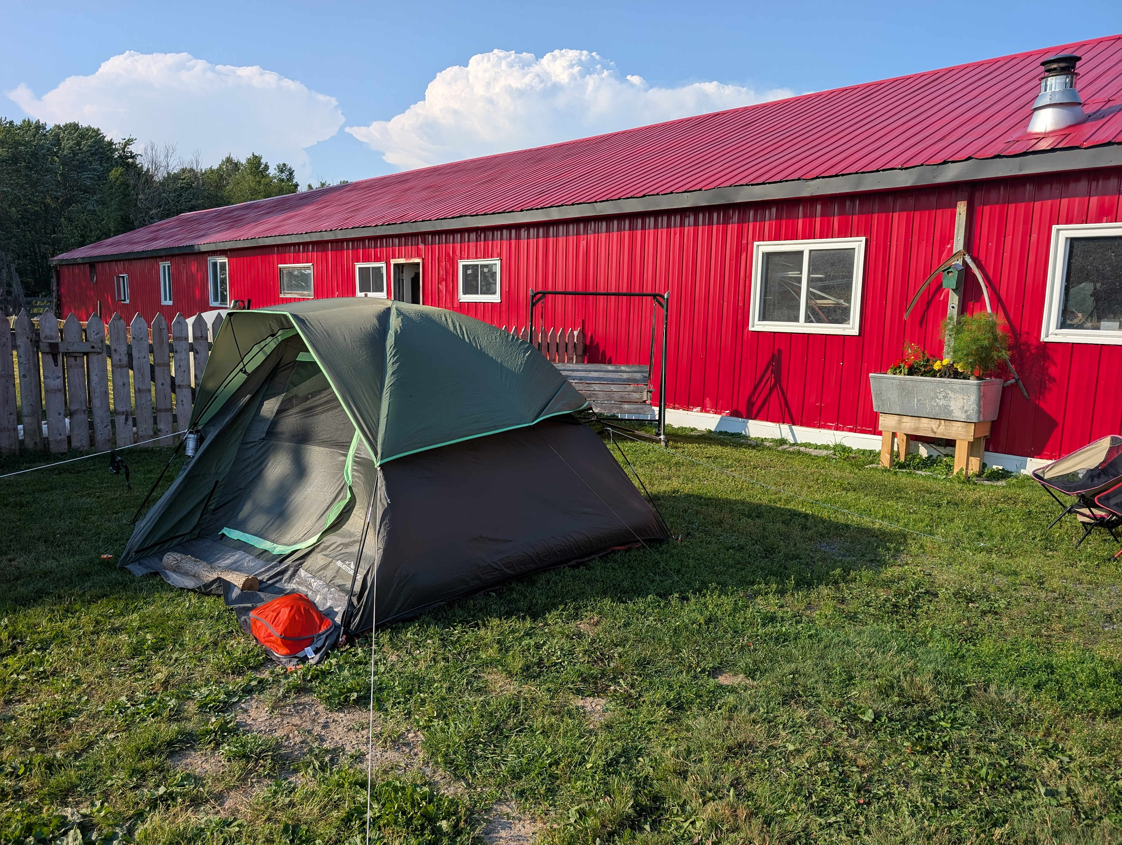 Our little tent, which we put next to their barn b/c it was next to the bathroom, but we could have chosen to isolate ourselves in a large field. 
