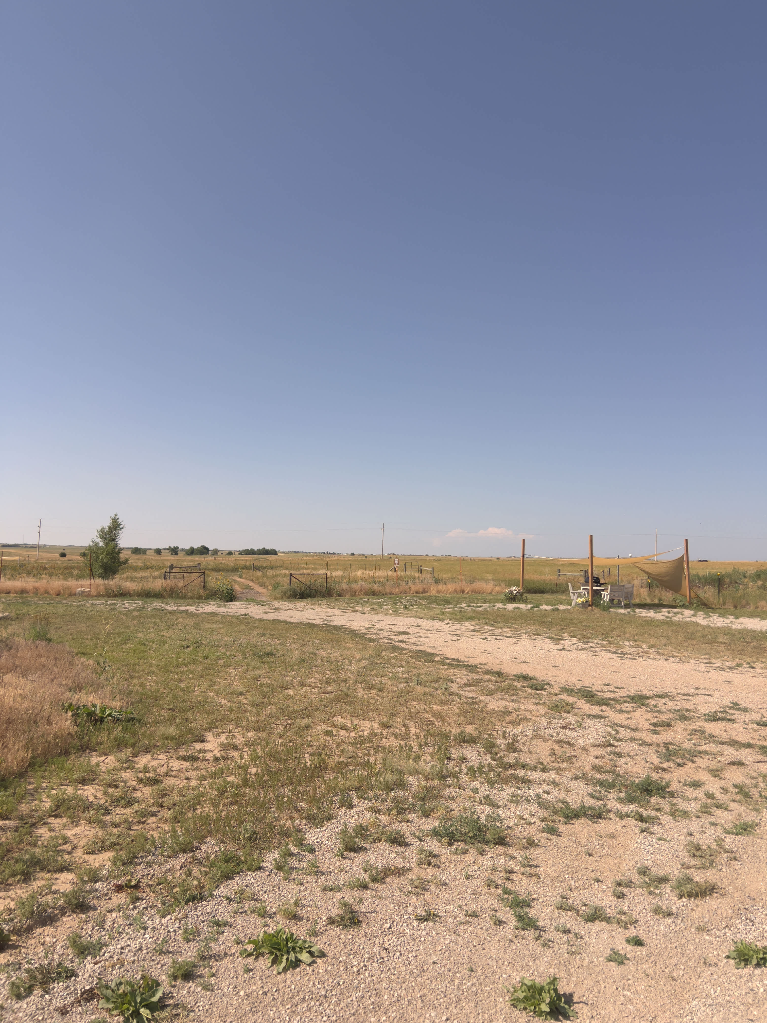 A tent site and gate to back of property