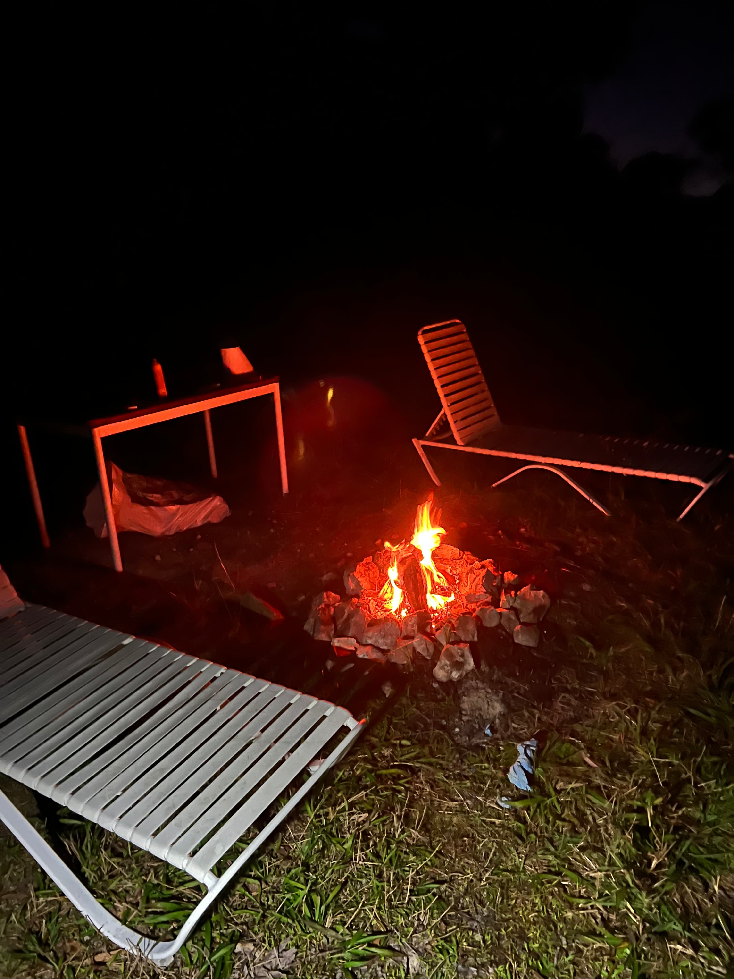 Lounge chairs, table and already made fire pit provided