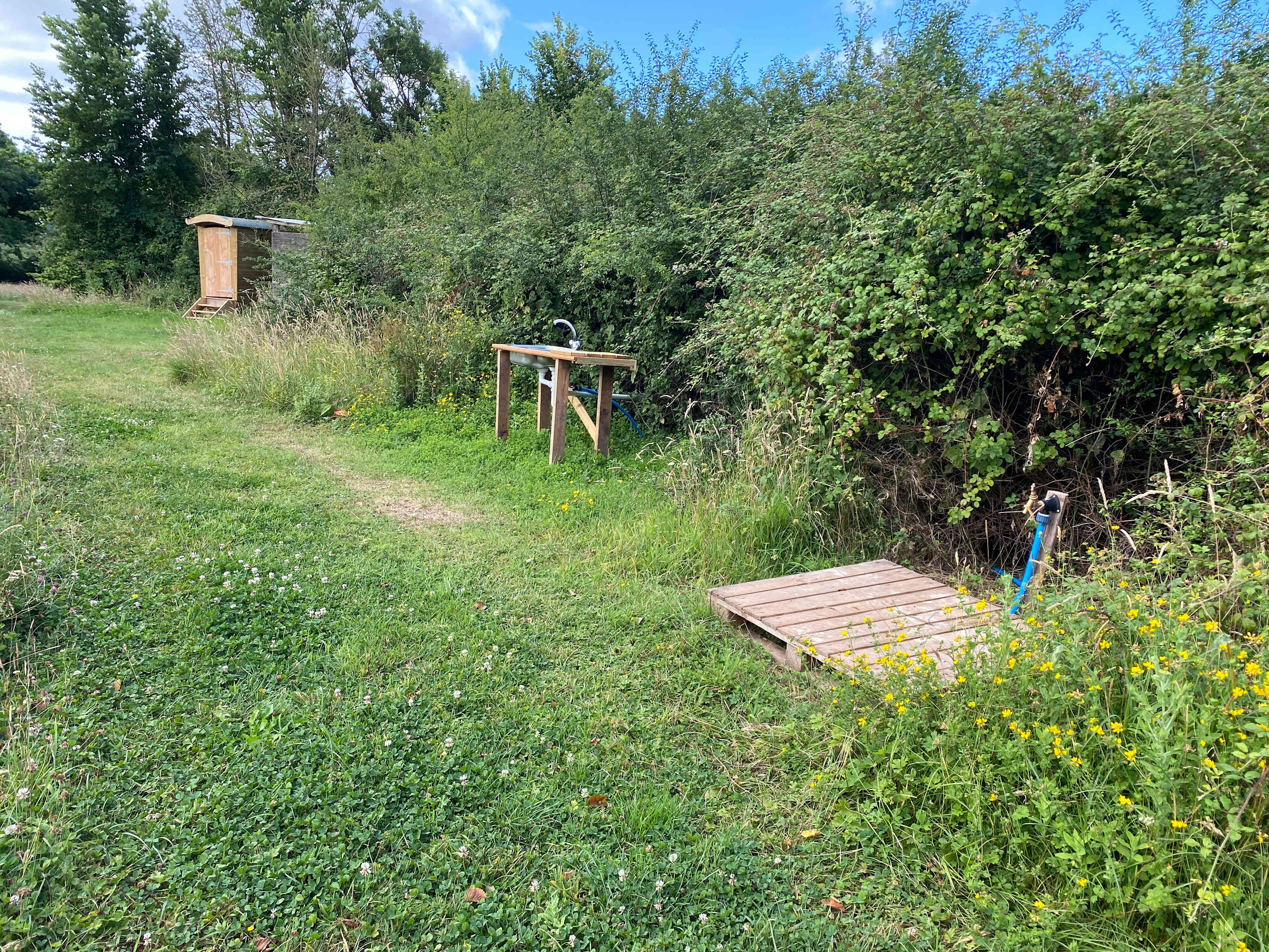 The shared facilities (Composting Toilet, Shower, Washing-up sink, drinking water tap)