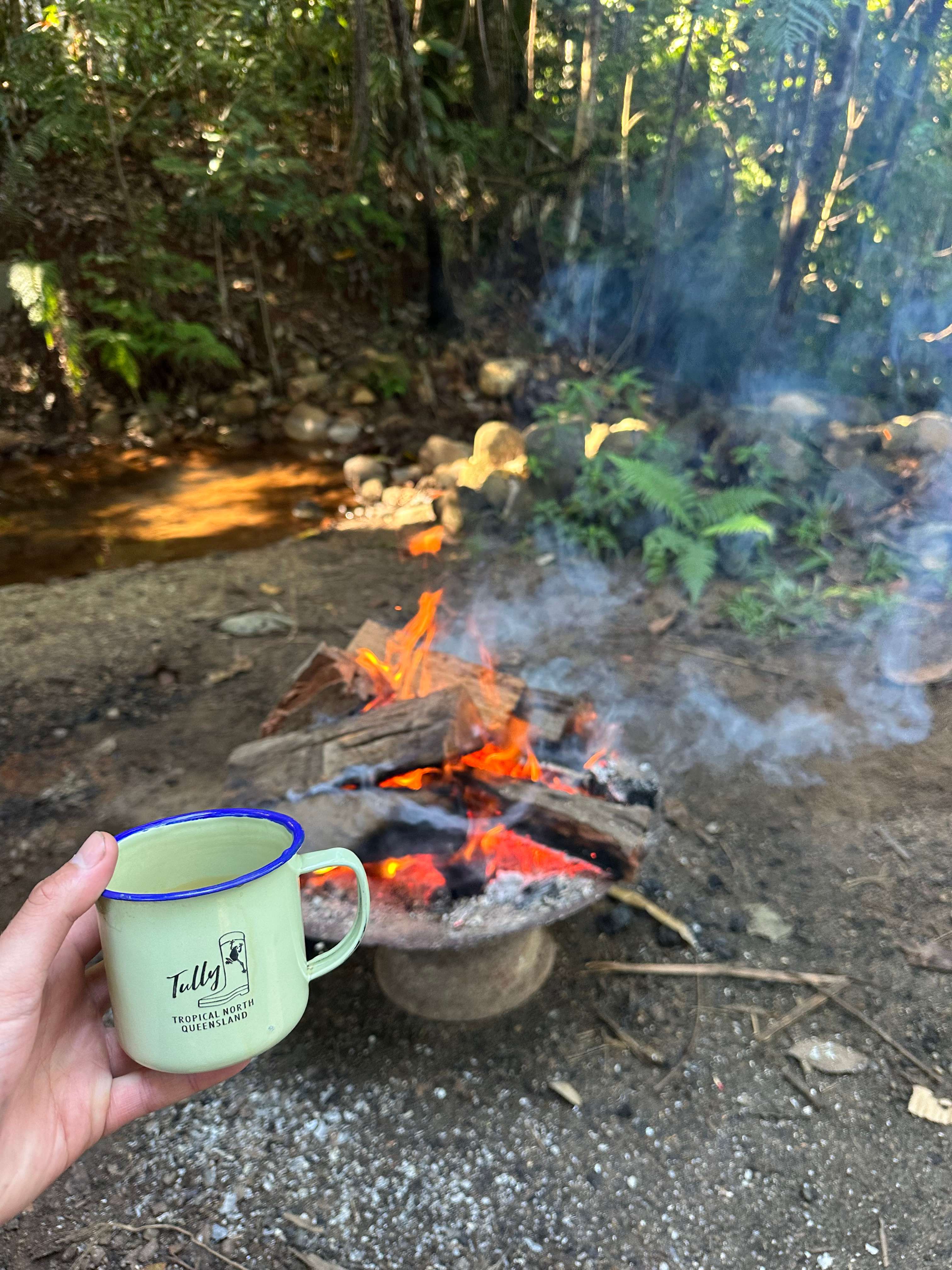 Campfire at waterfall site 