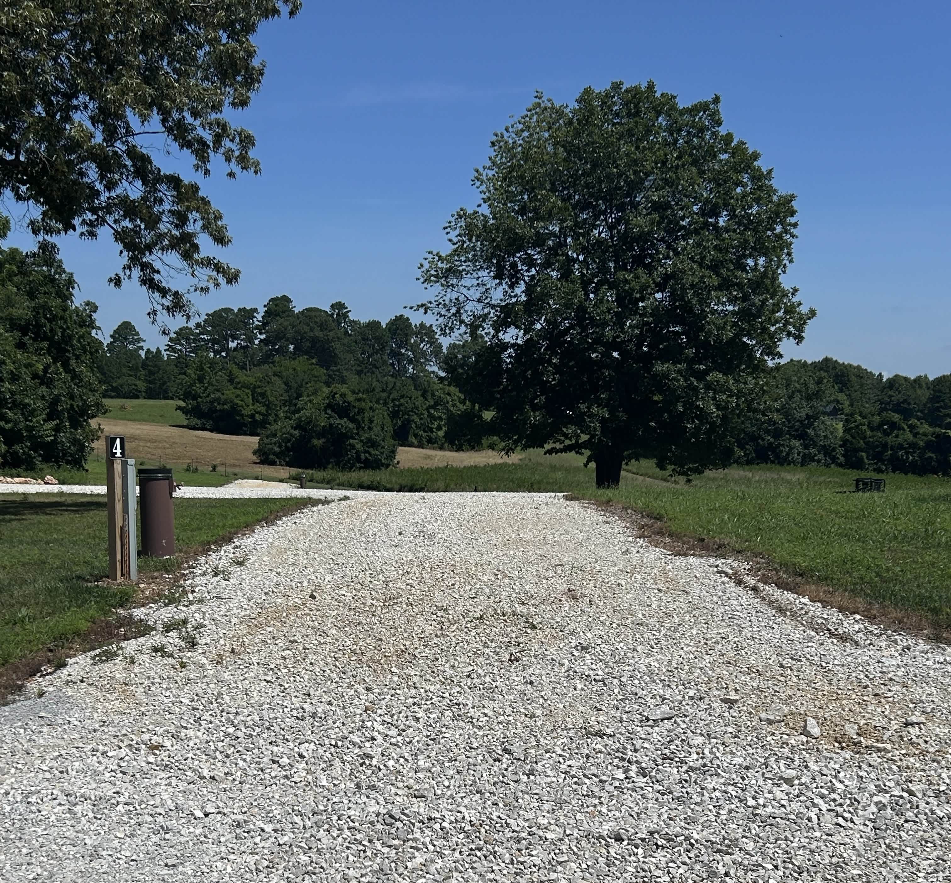 View of Site #4 - it is a pull-through with full hookups. Site length is approximately 90' in length.