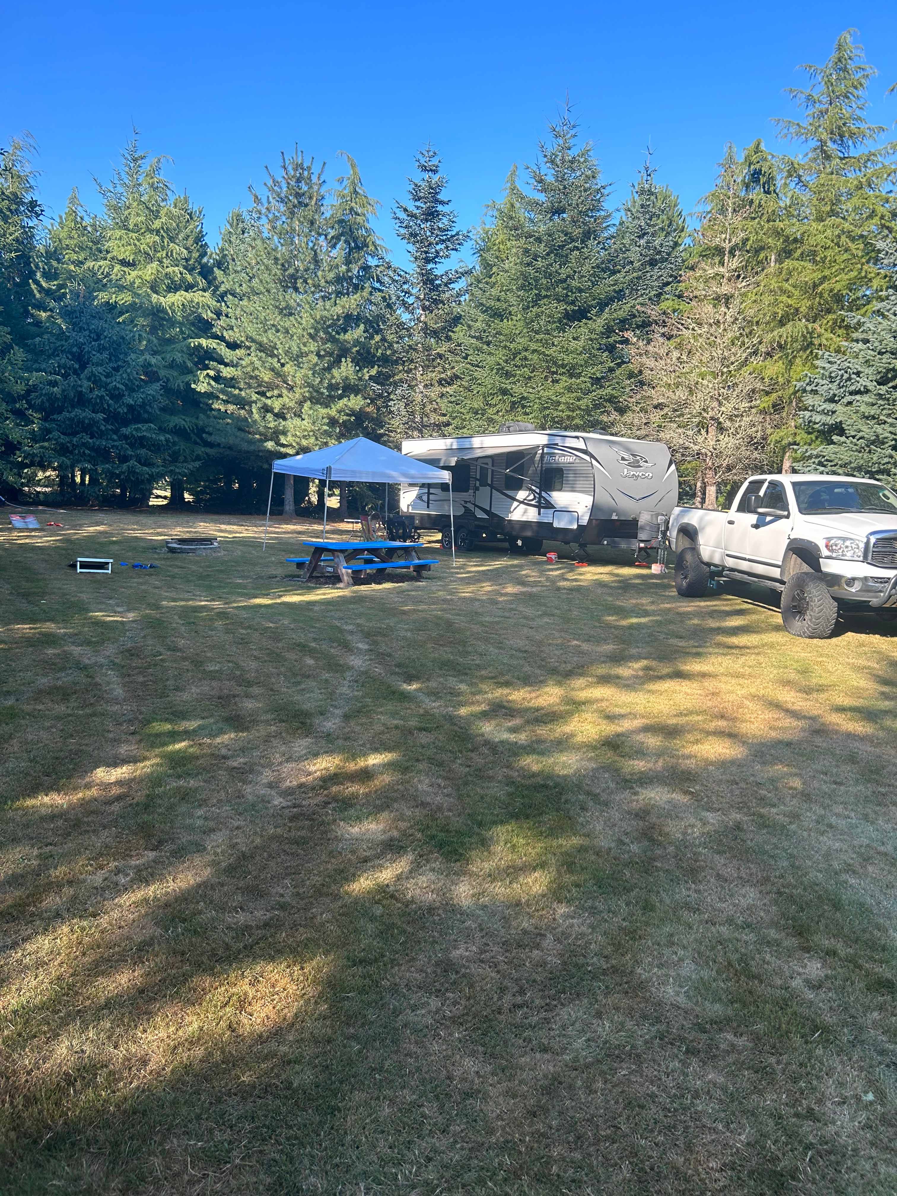 Blue site, 34’ toy hauler. Water hookup on site (use a pressure regulator), very spacious gorgeous site wrapped in trees. Beautiful views of the night sky, wildlife all around in the mornings and evening’s. 