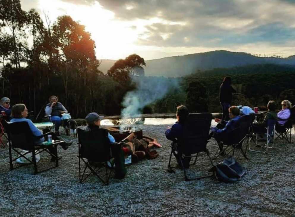 Guests sitting by the camp fire in our camp area.