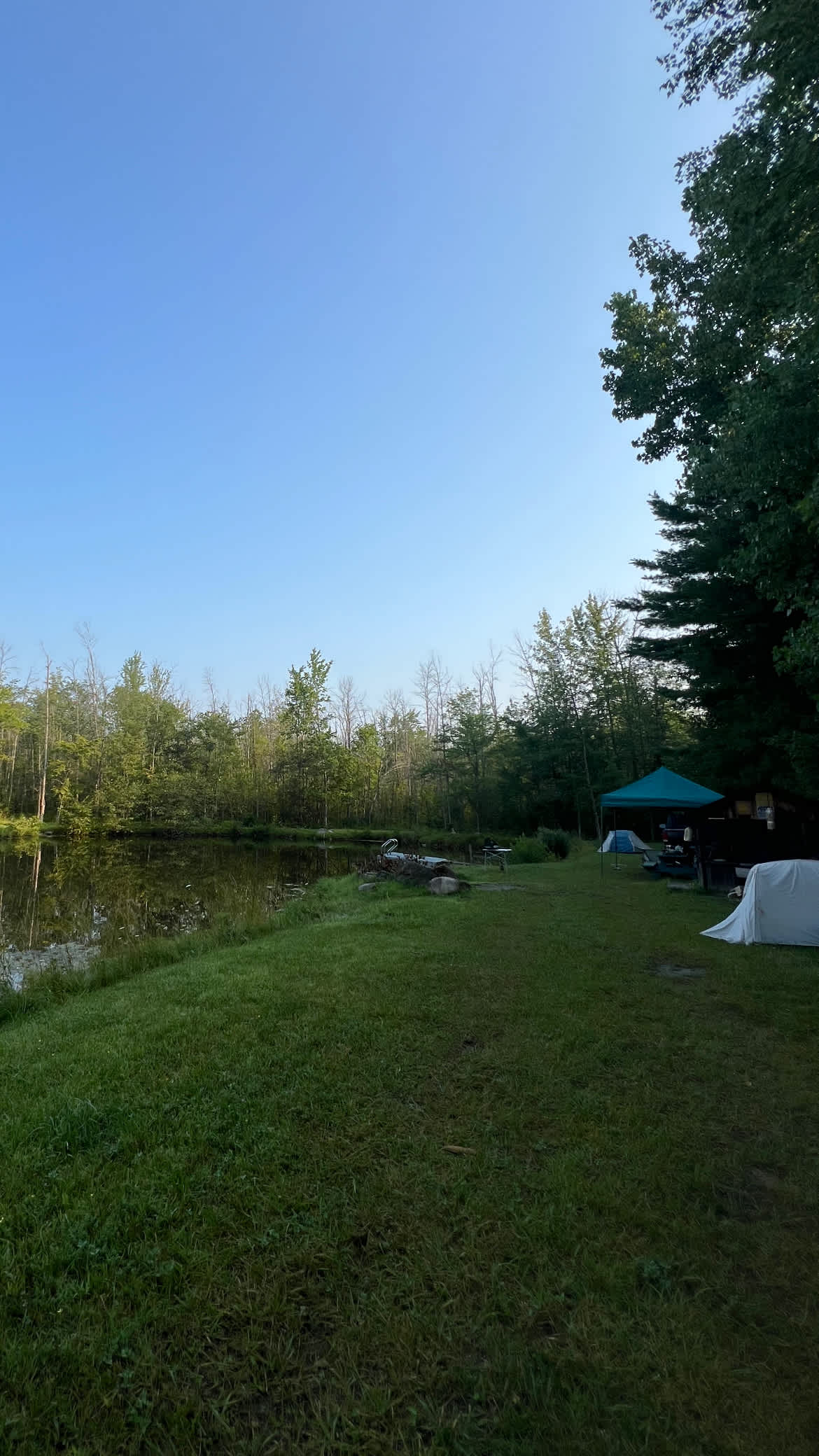 Tent camping next to private pond