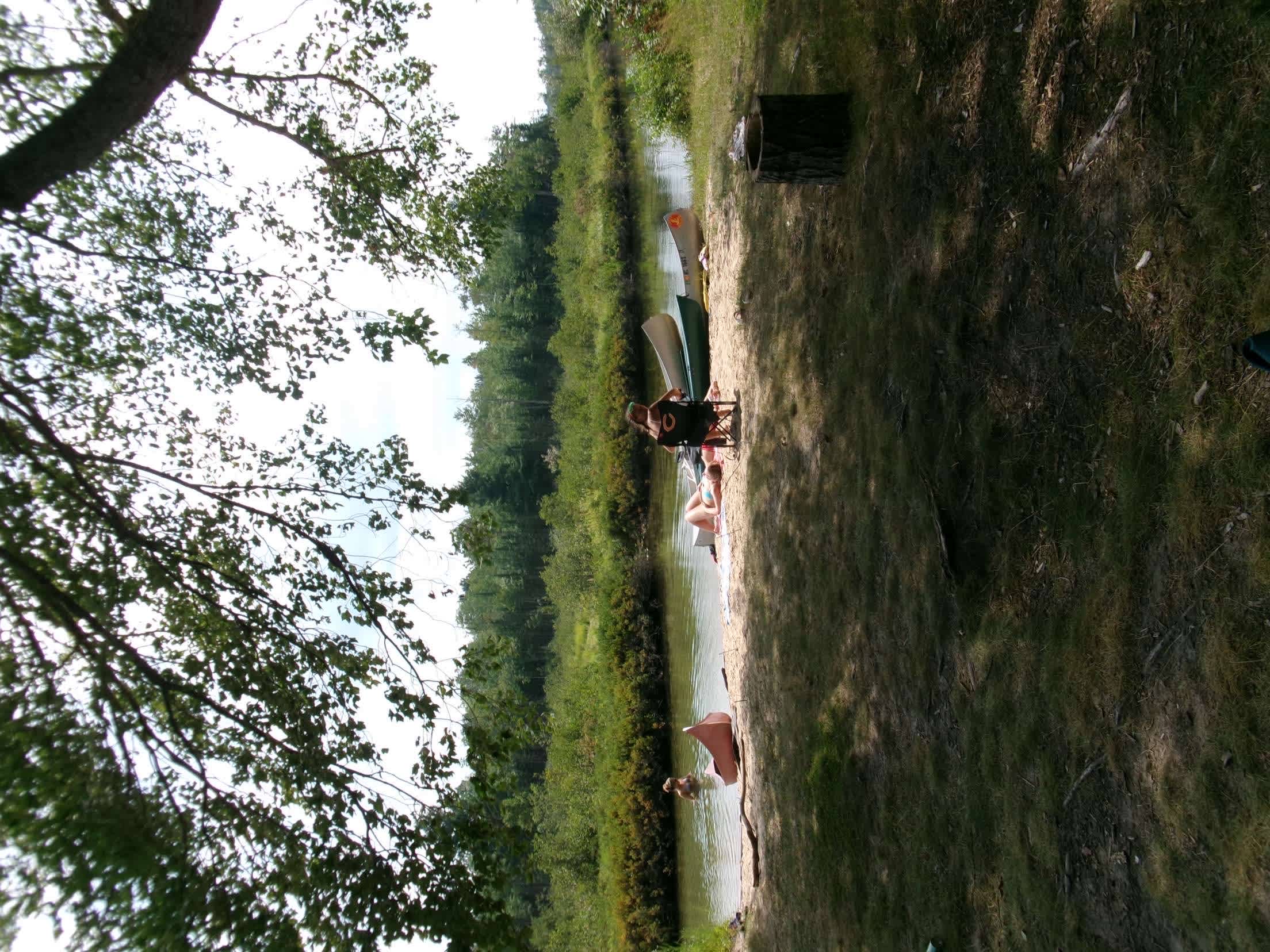 Little sandy area on the river with the canoes!