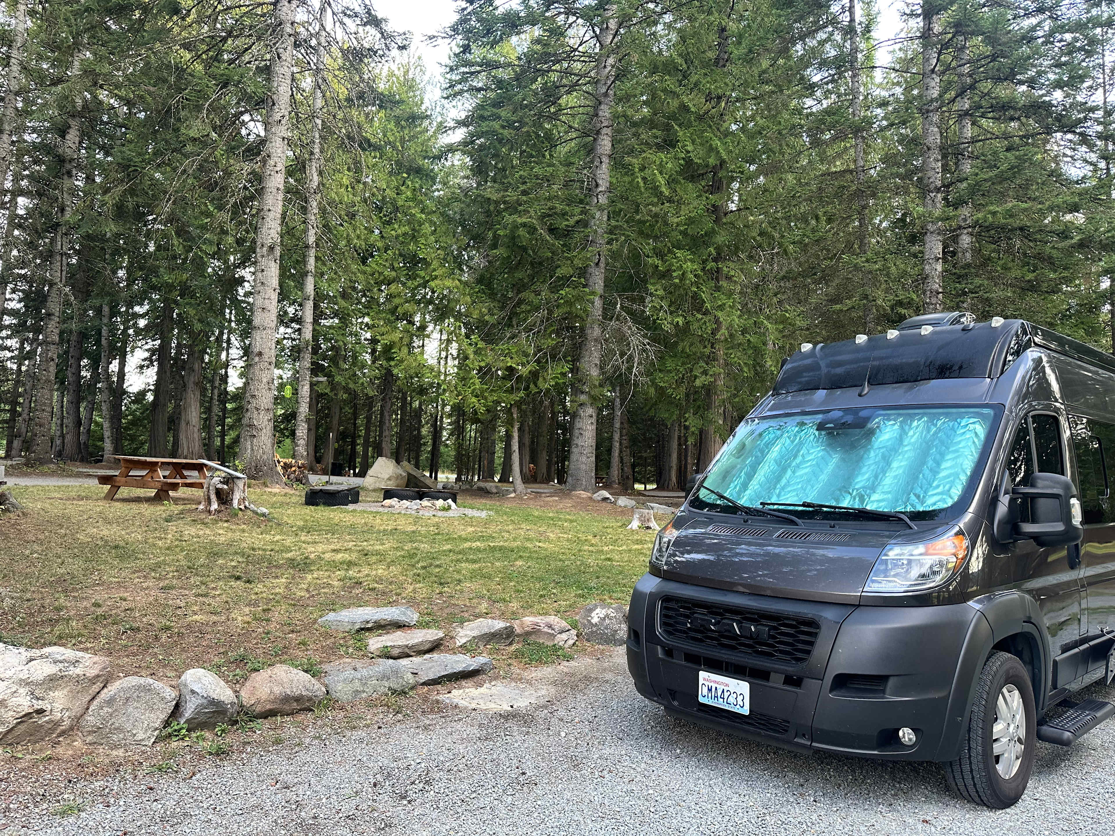 Generous raised picnic / fire pit area adjacent to easy-access pull-through site. 