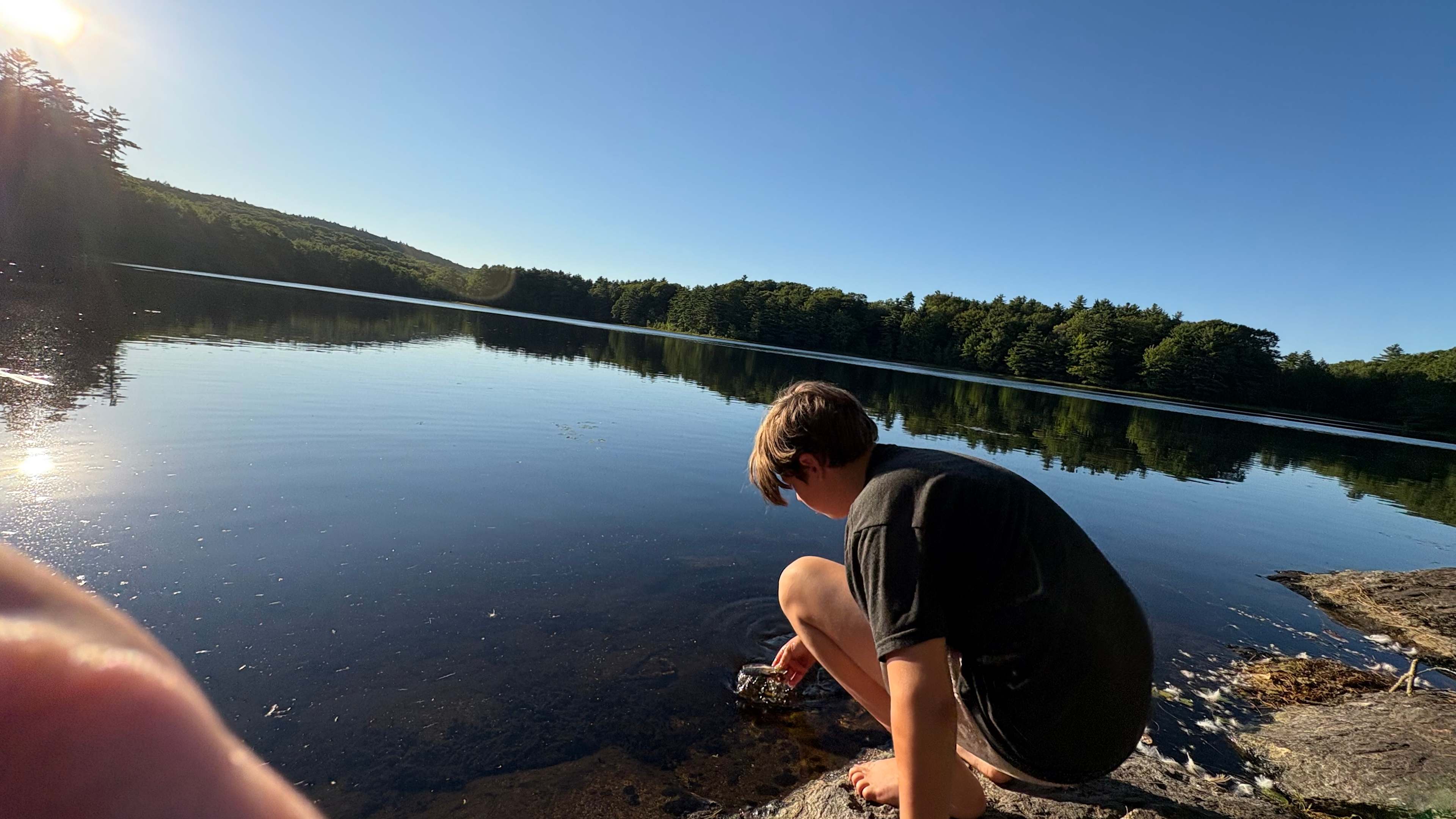 Walk from site to lake in nature preserve 