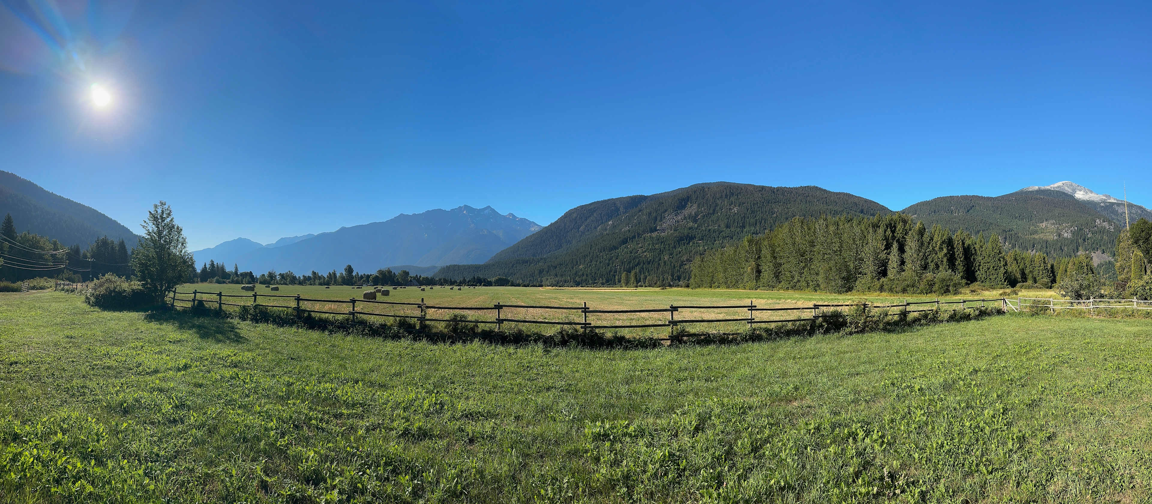 A view of the meadow and the mountains from Gabe's place on a sunny day