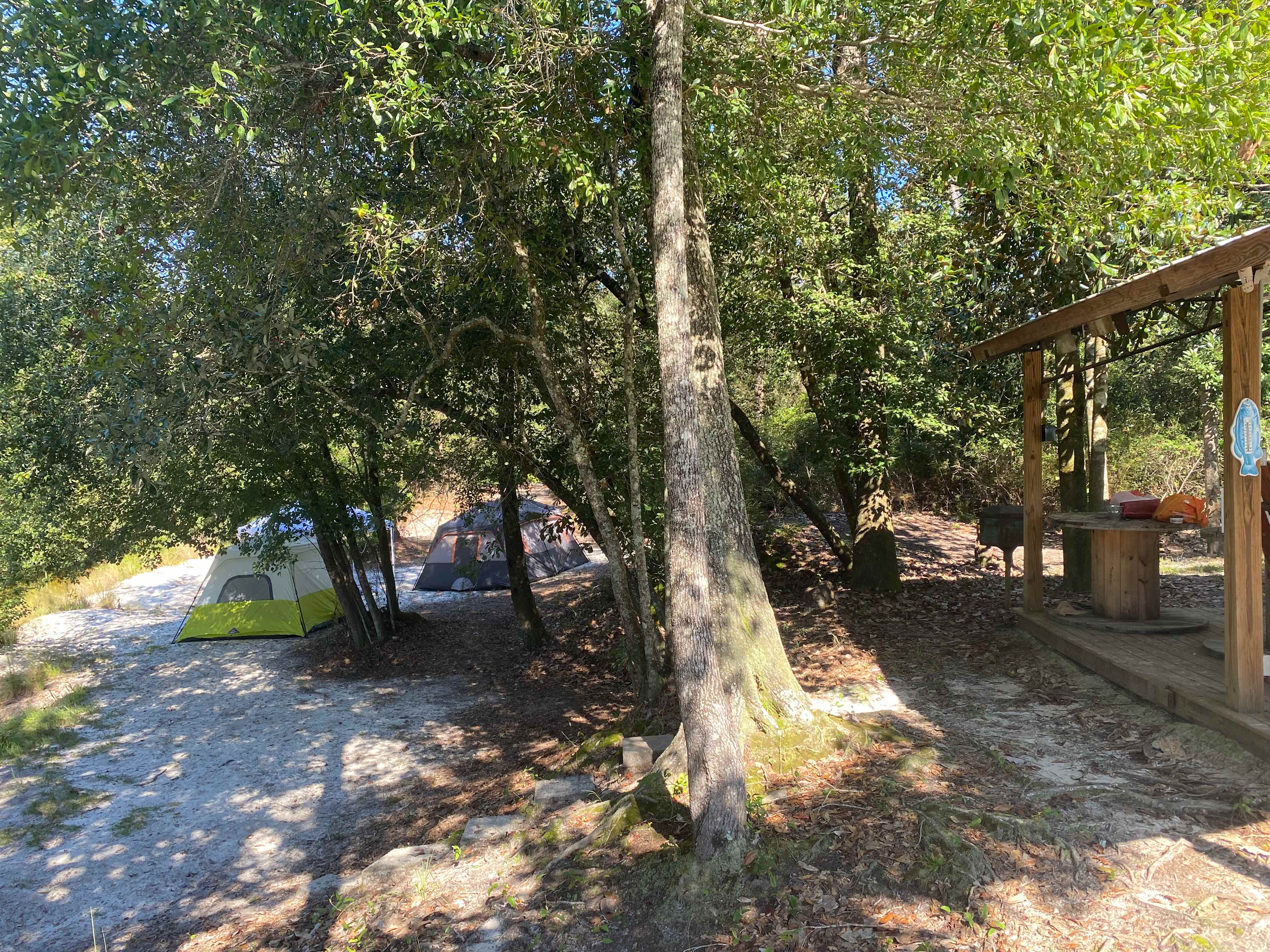 Camp spot in relation to the pavilion. We were able to run a 100 ft extension cord down from the pavilion to both of the tent and plug in fans. However, the weather was great so we didn't really need them. 