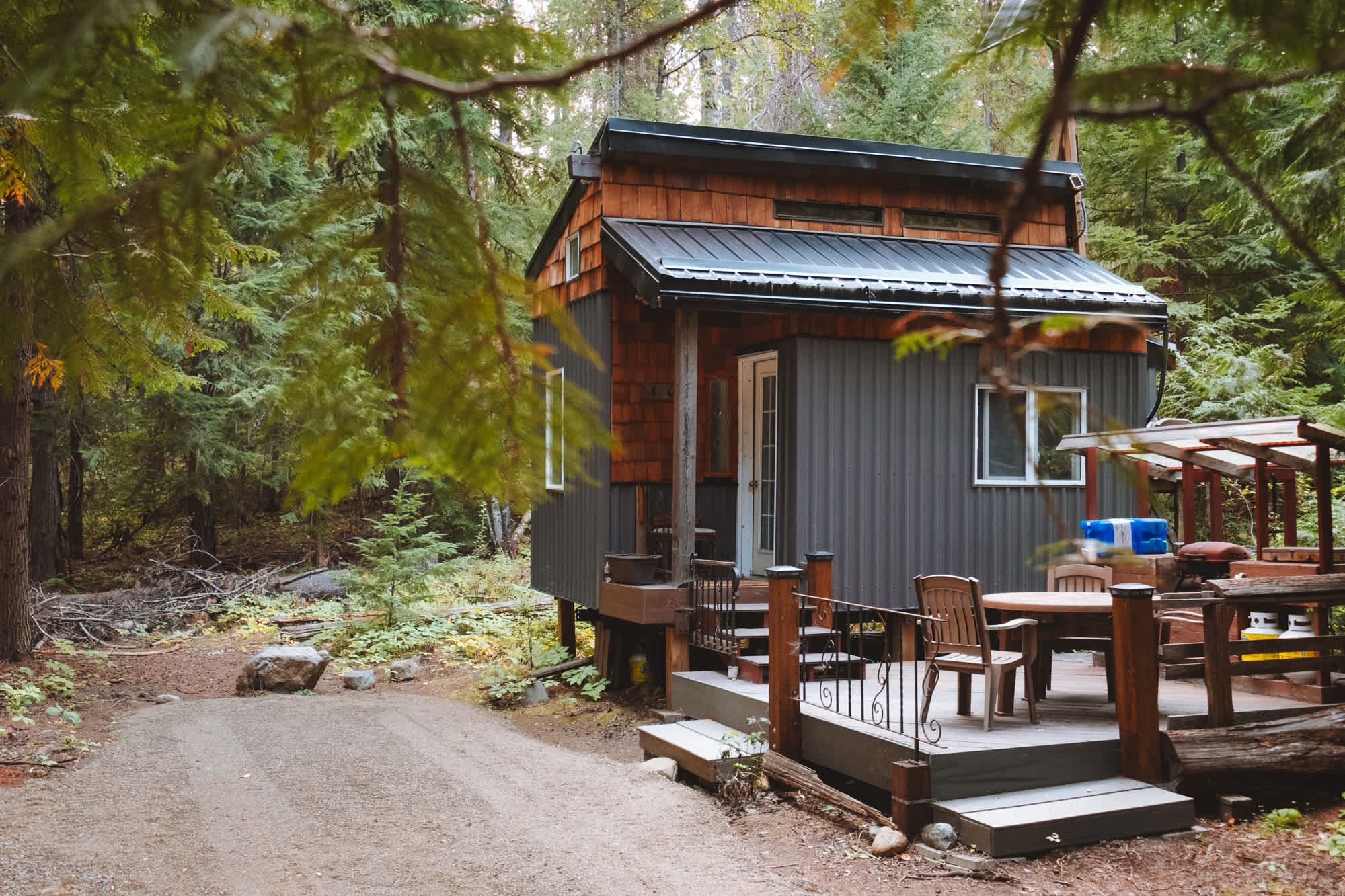 The tiny house and your parking spot amongst the trees!