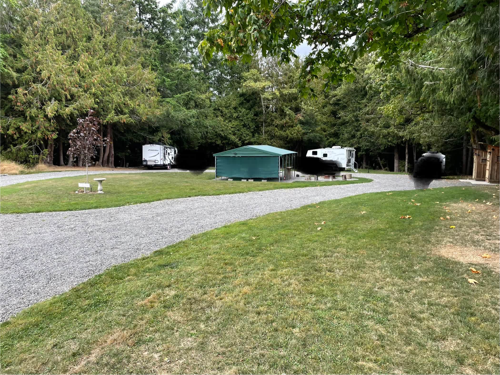 From the loop entrance, by the play ground. Outhouses can be seen to the right. 