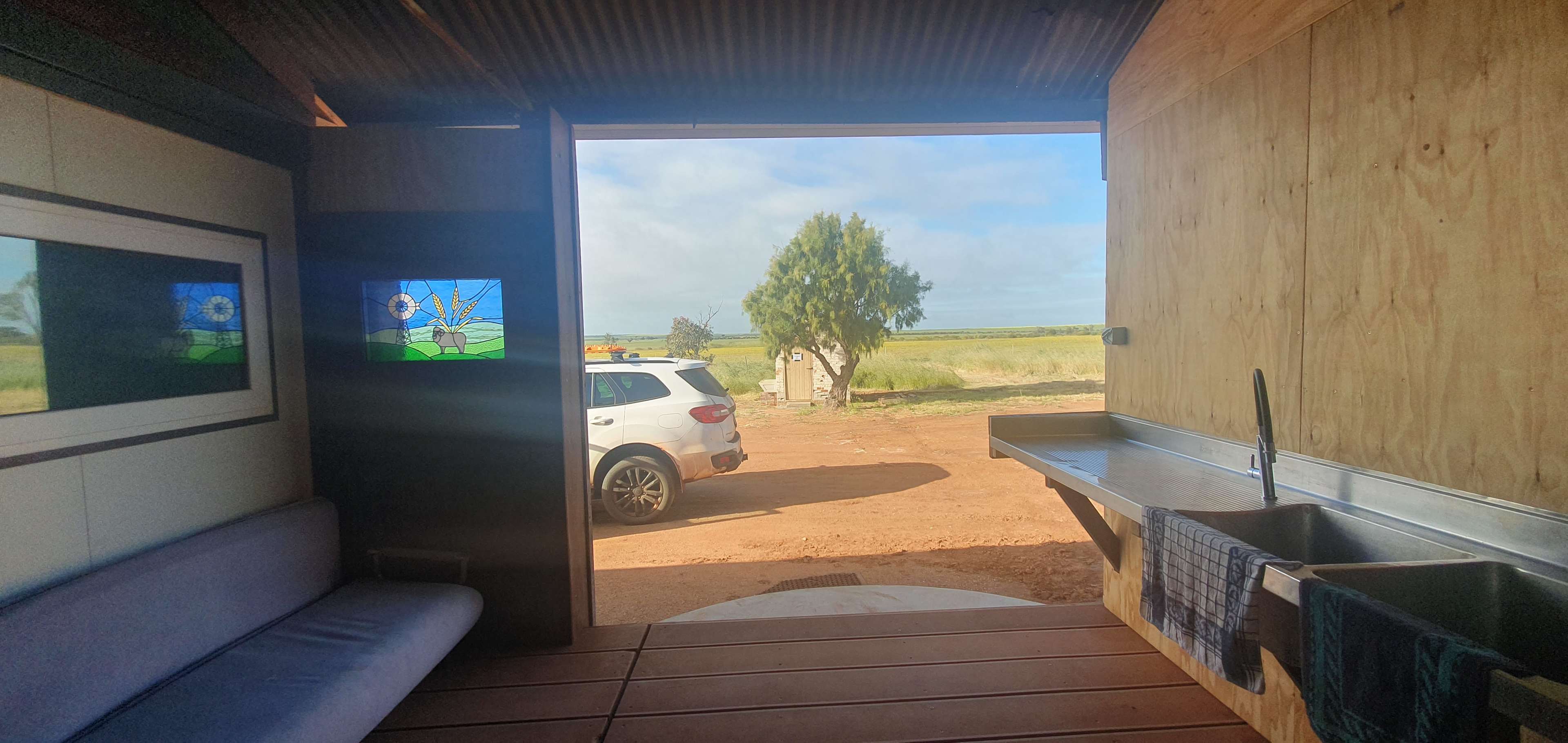 Views from our accommodation verandah providing privacy and a spacious outlook over the farm. Do be aware you will need to take everything with you except for the kitchen sink :-) Jude provides all bedding, bath, hand and tea towels which was perfect for us! 