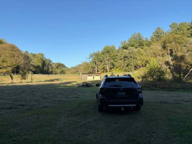 Open field opposite site, onsite bathroom past structure in pic.