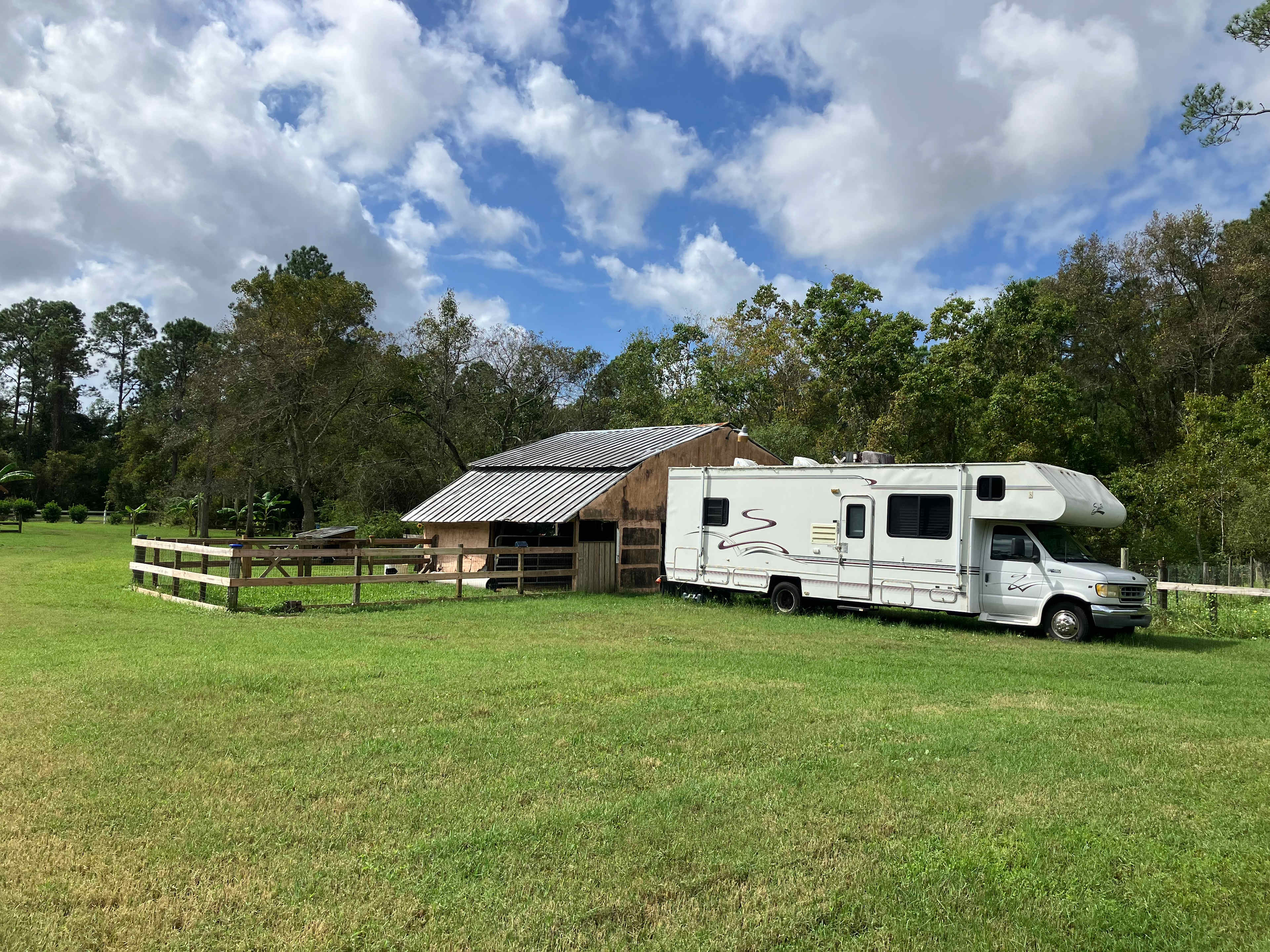 Example of RV positioned beside the barn area in the center of the property. Guests will be near our small farm animals in a peaceful rural setting.