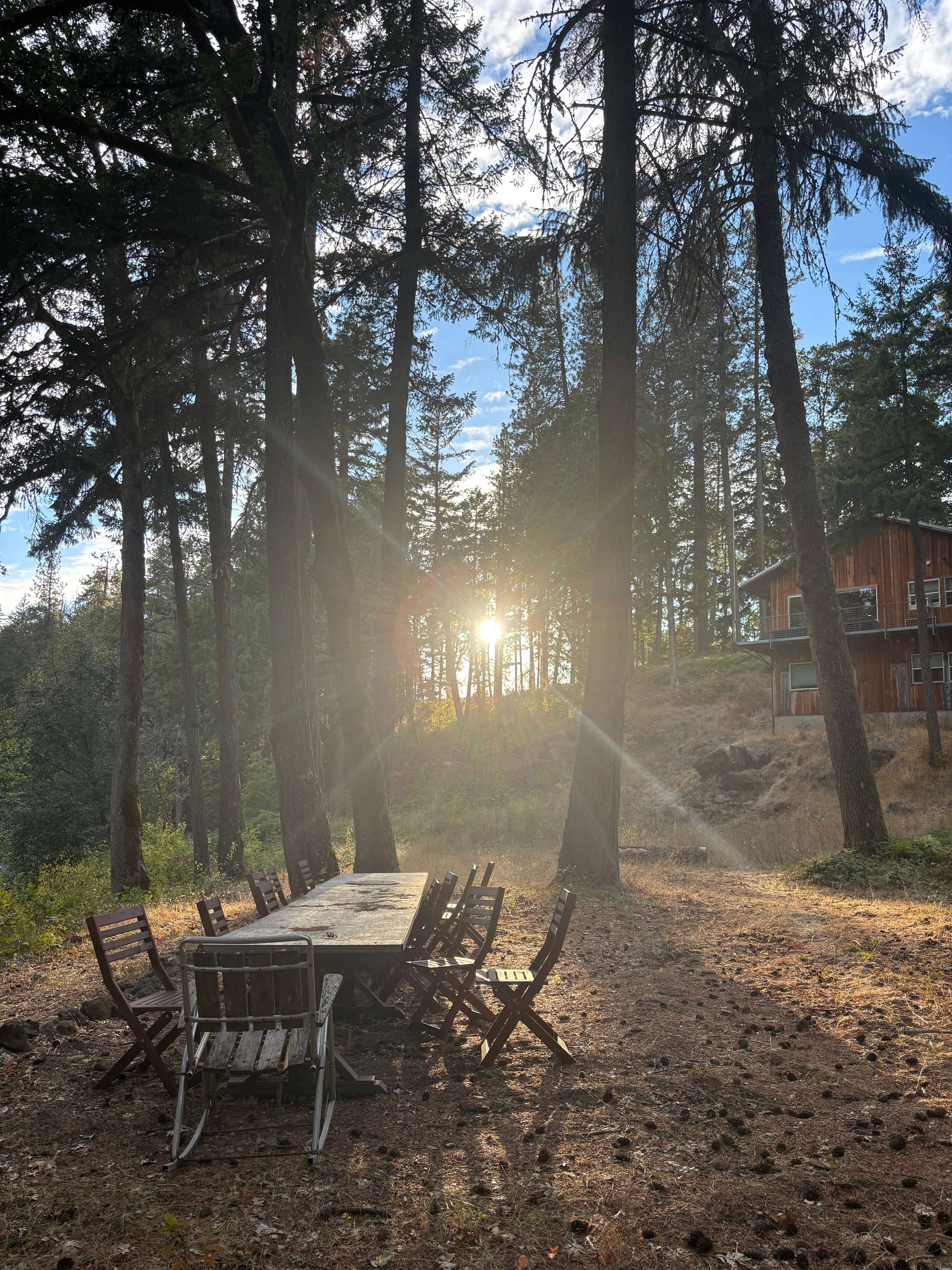 Large outdoor table by the river and kitchen