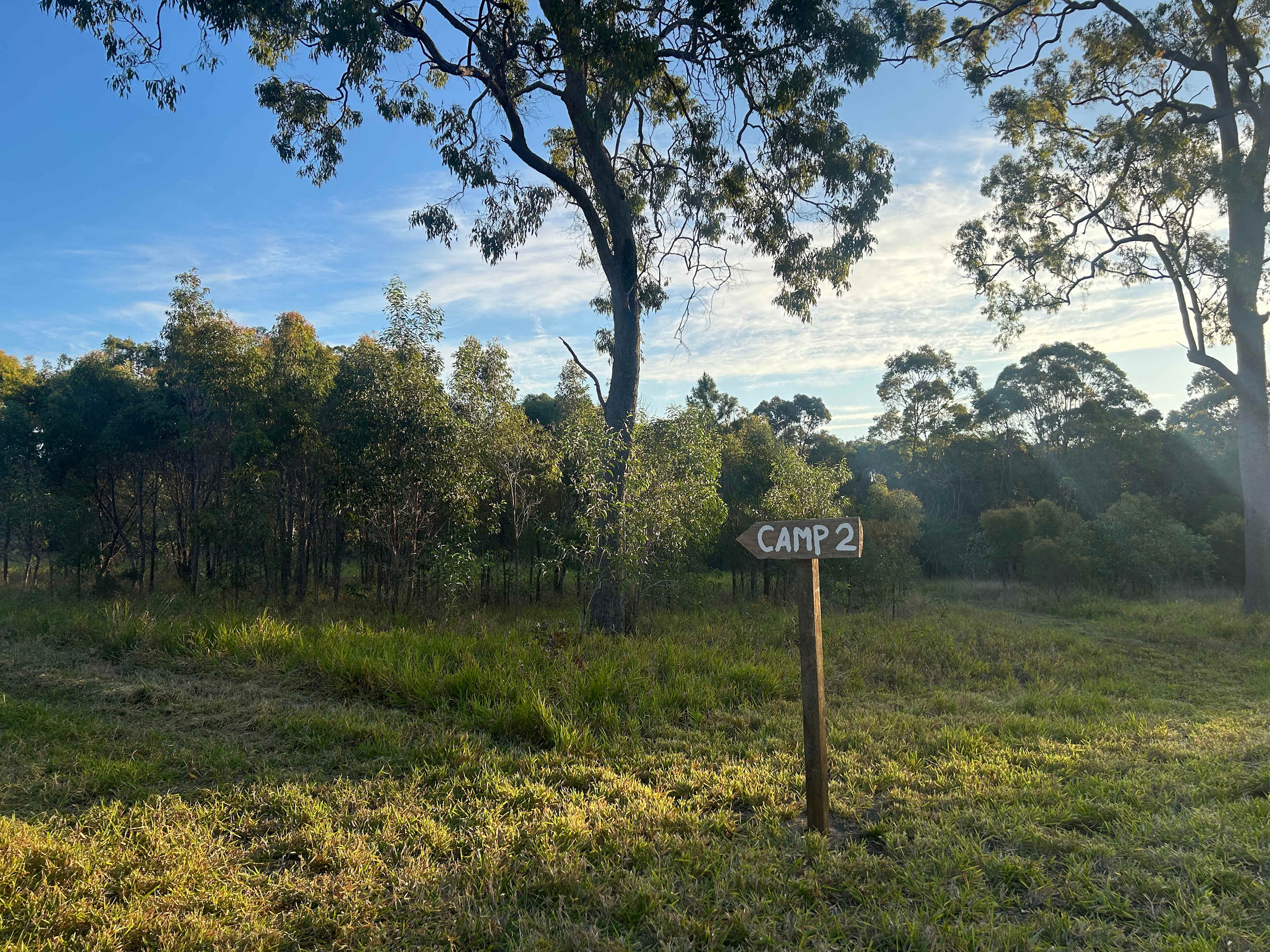 Turn left towards camp site two and find a space anywhere in the mowed area.