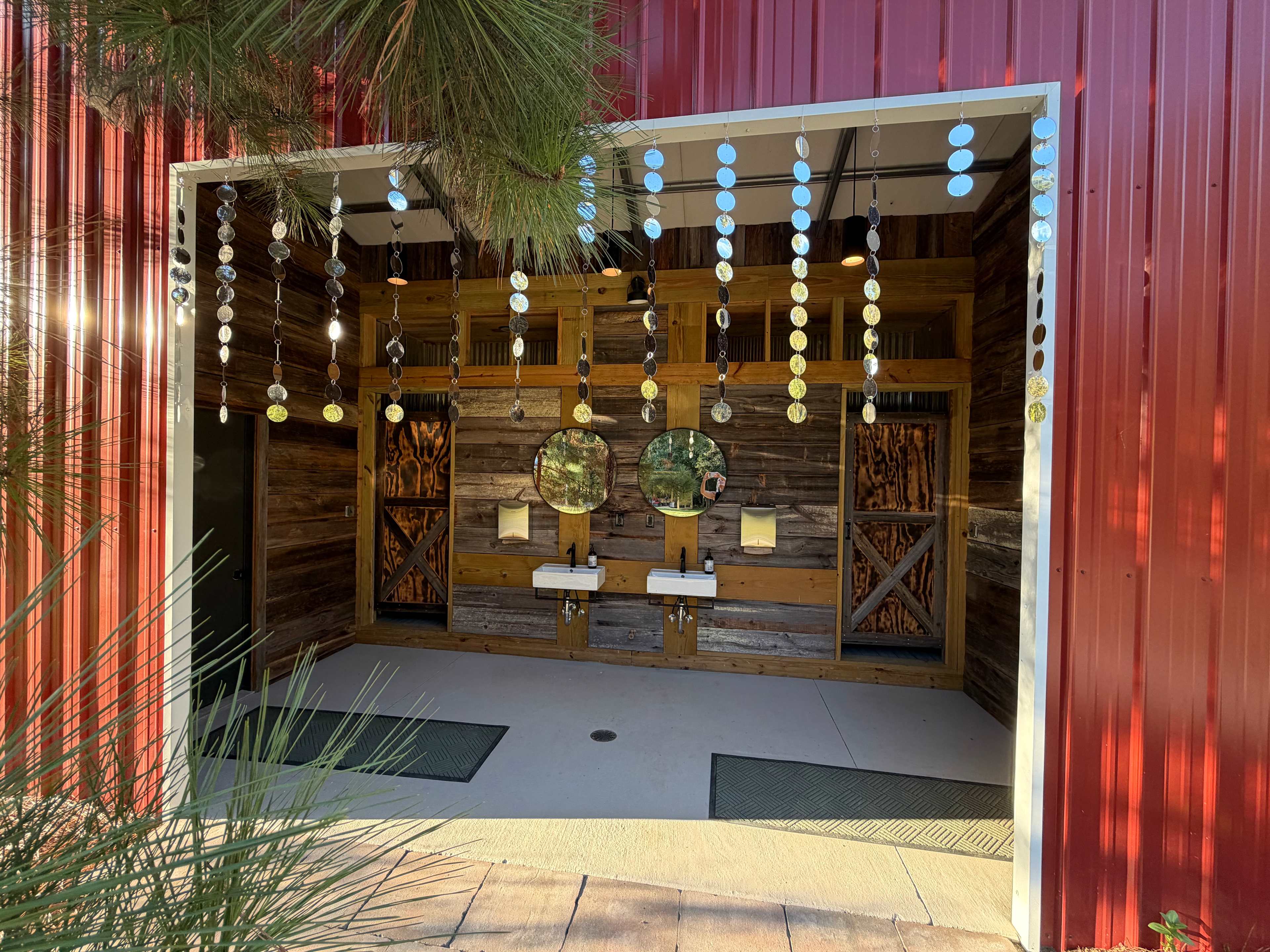 Bathroom/shower area with outdoor sinks as well as private sinks in the bathrooms.
