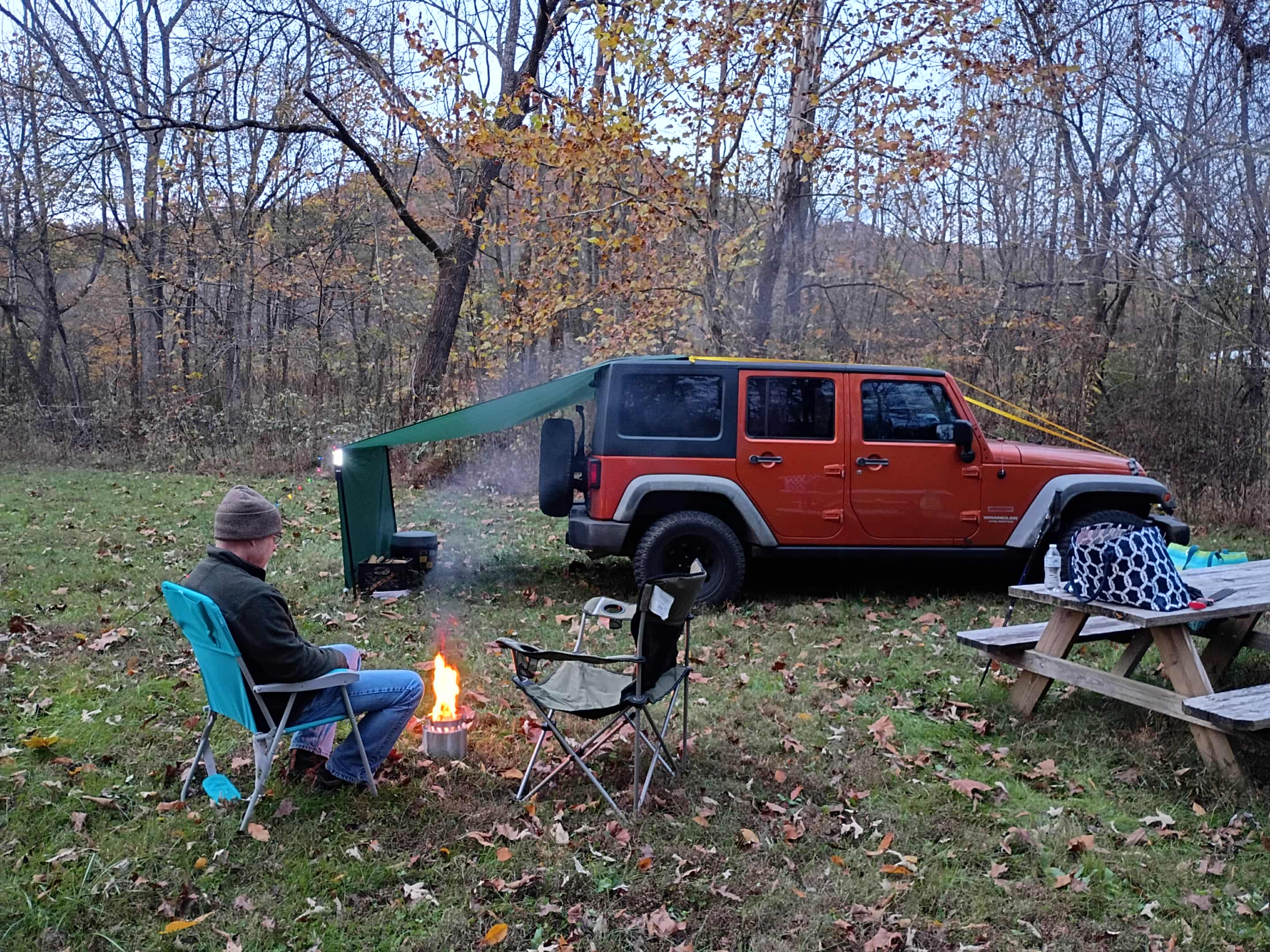 Camping with portable Ozark Trails Steel Fire Pit. Perfect for two people.
