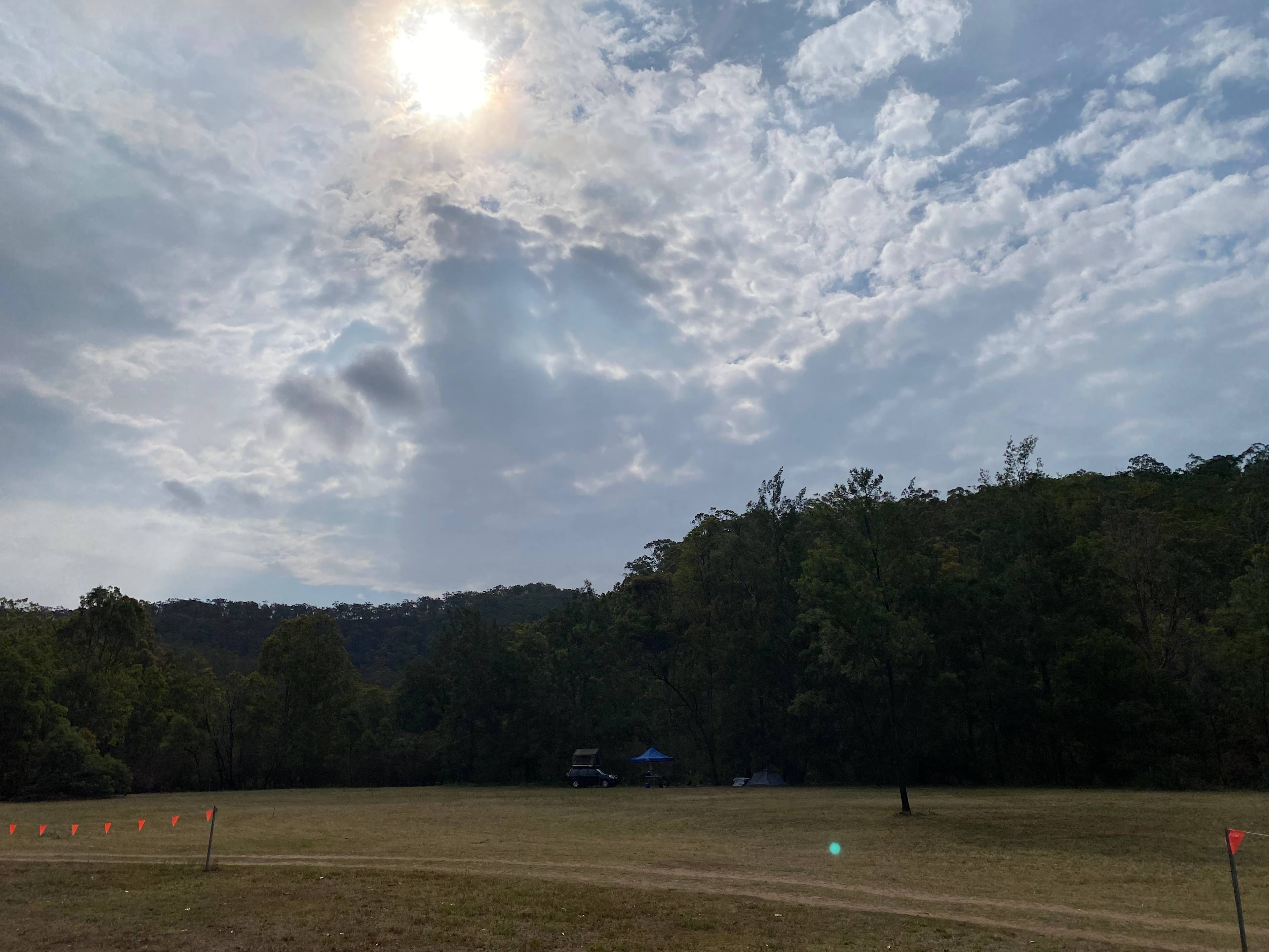 Large open camp area. Sites around the edge