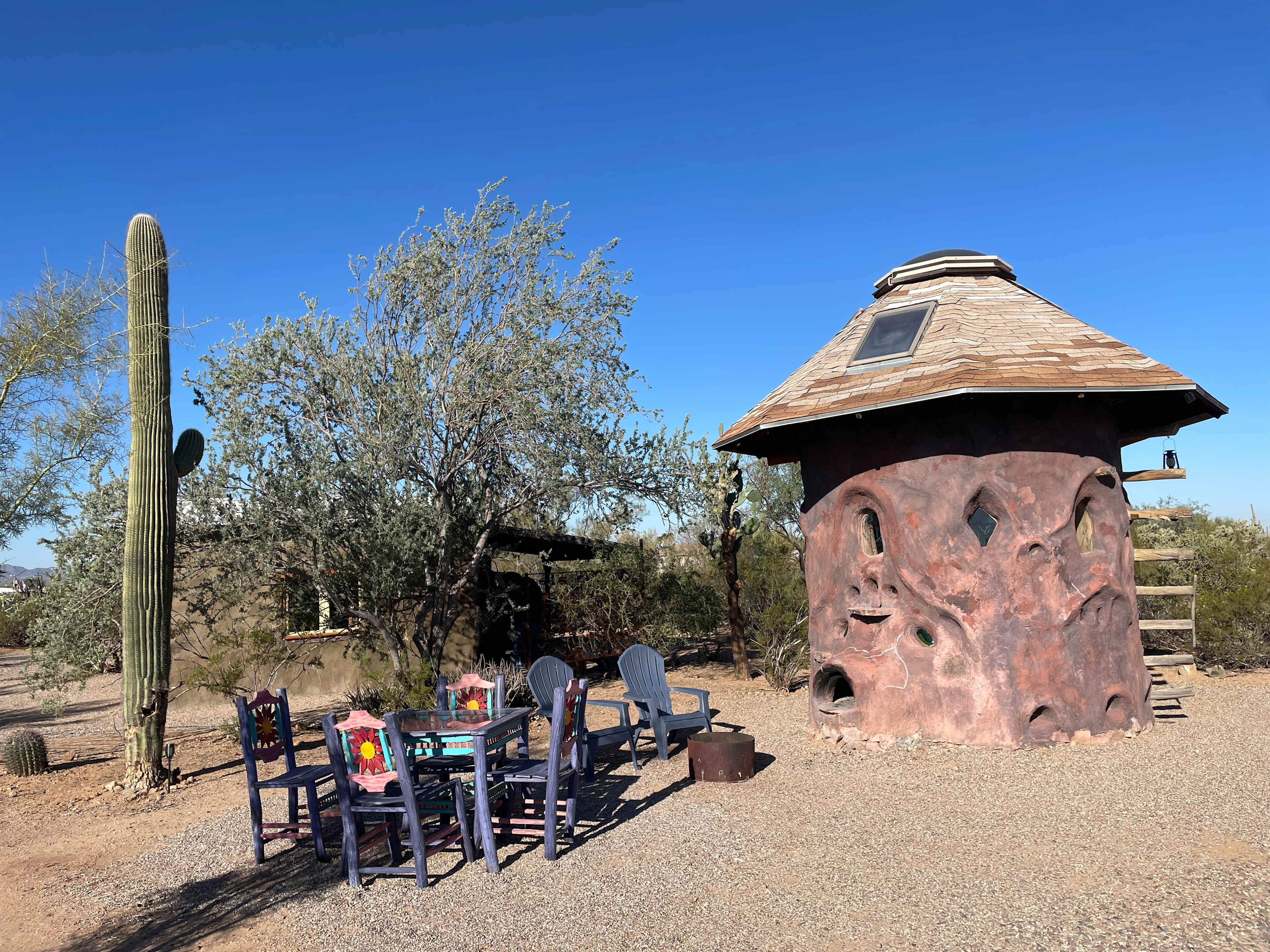 Adobe house on the left, mushroom house on the right. 