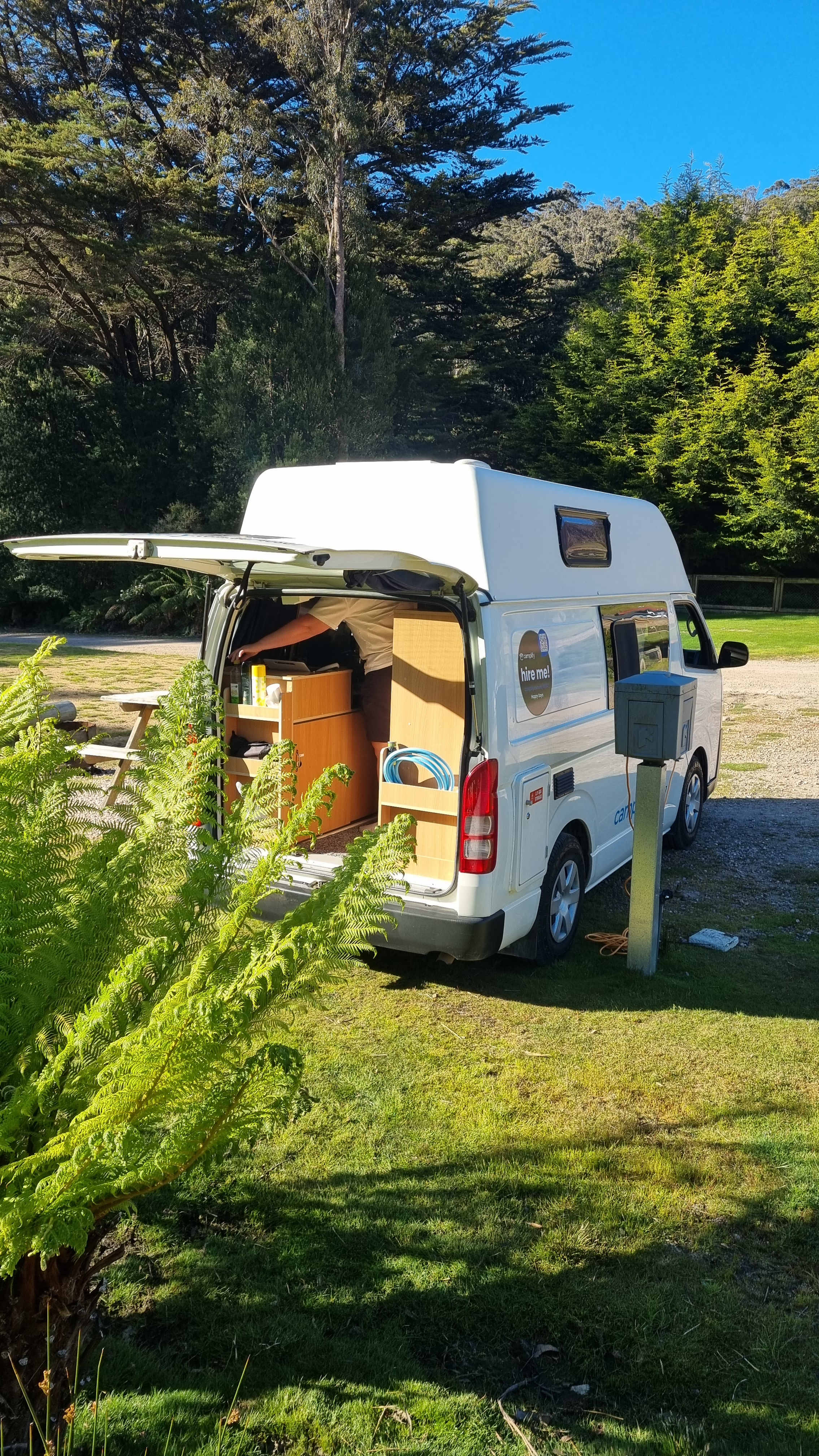 Powered camp-site. Picnic bench to the left, with a fire pit. Perfect for relaxing 