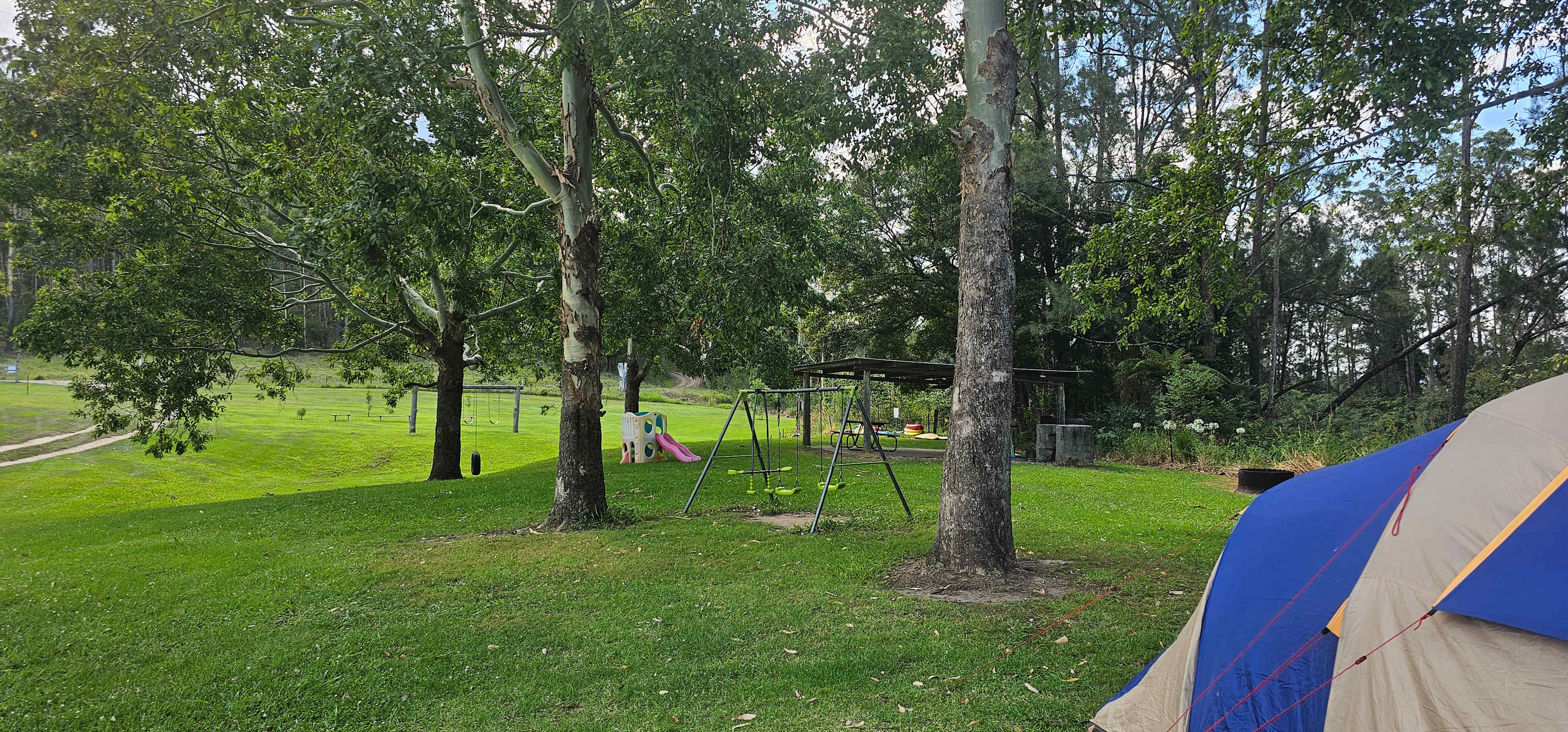 Communal area next to site 3, swings for kids, bikes, kayaks, boogie boards. 