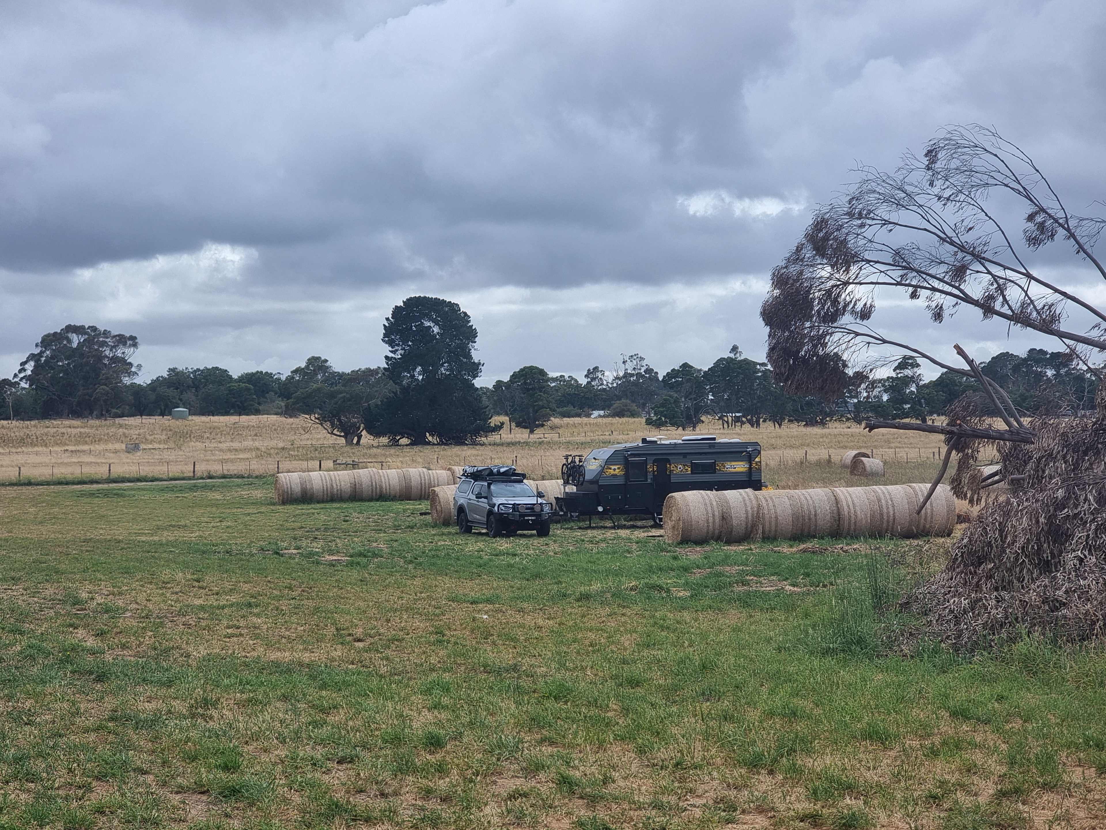 Spacious sites designated by hay bales and painted fence posts