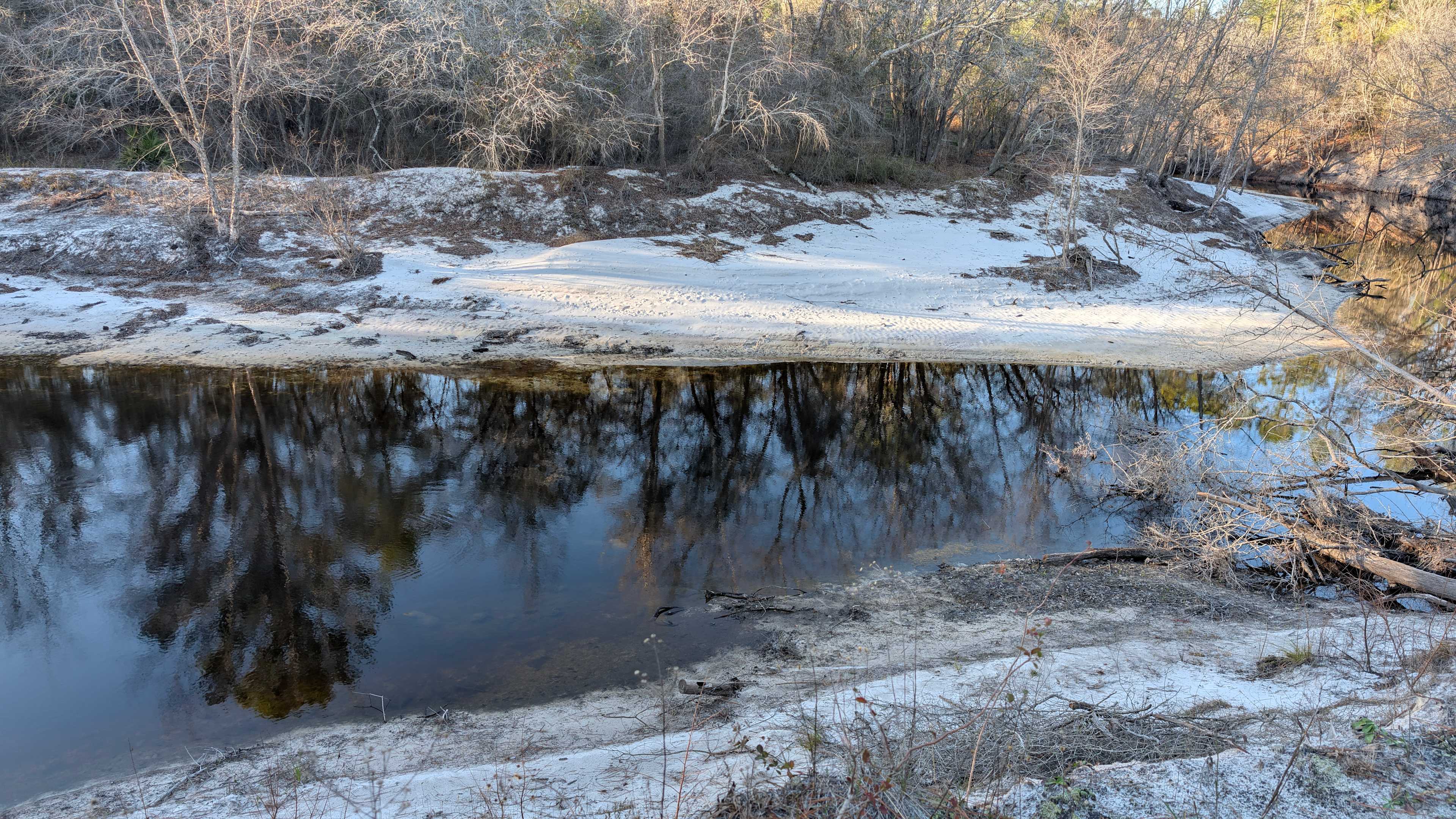 Beautiful white sand, wildly dark water, and a state line all for the price of admission. 