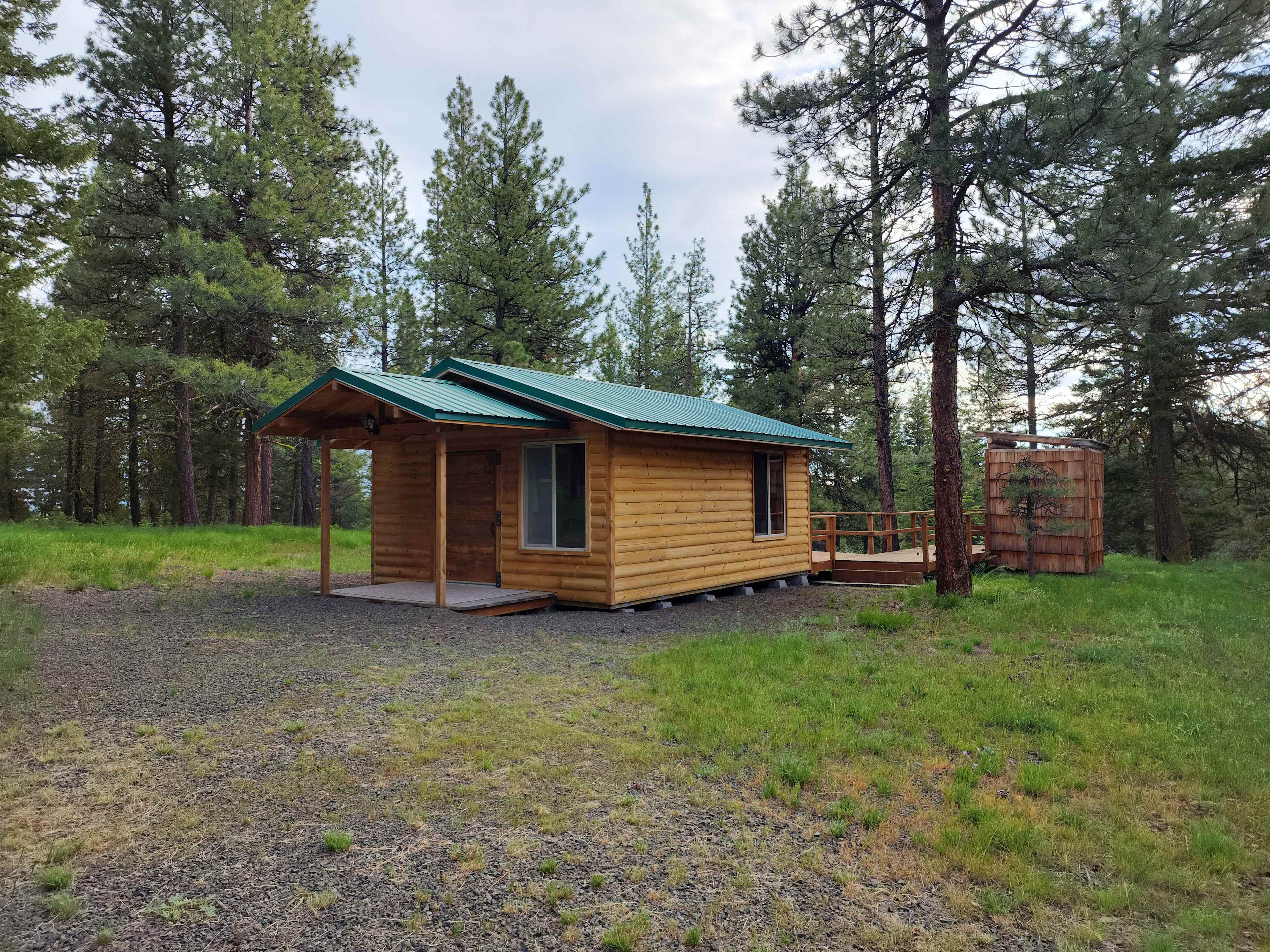 Sweet cabin - loads of parking space.  Fully accessible. Porta Potty behind and to the right.
