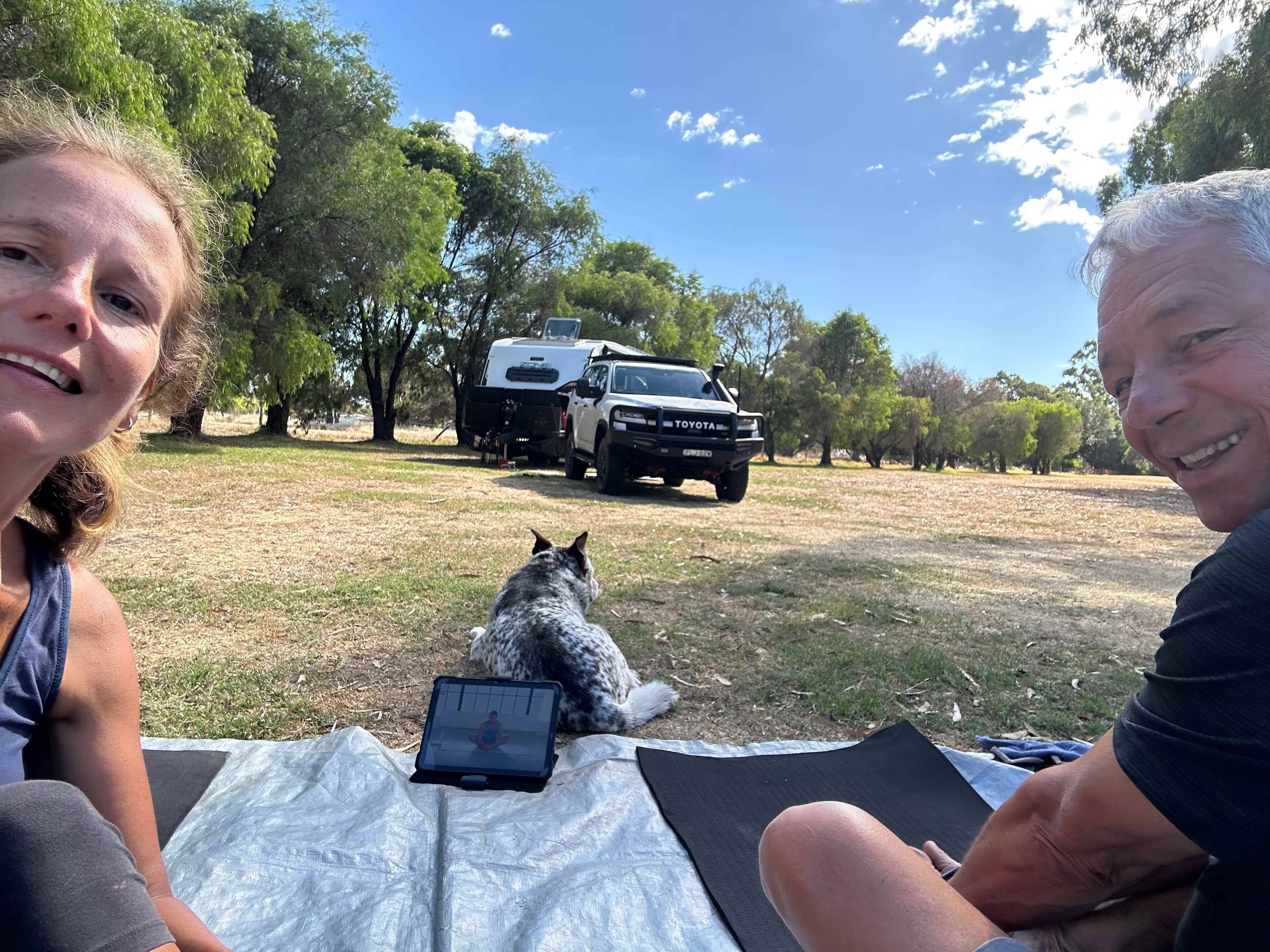 Ace assisting with our morning yoga. Keeping us honest 
