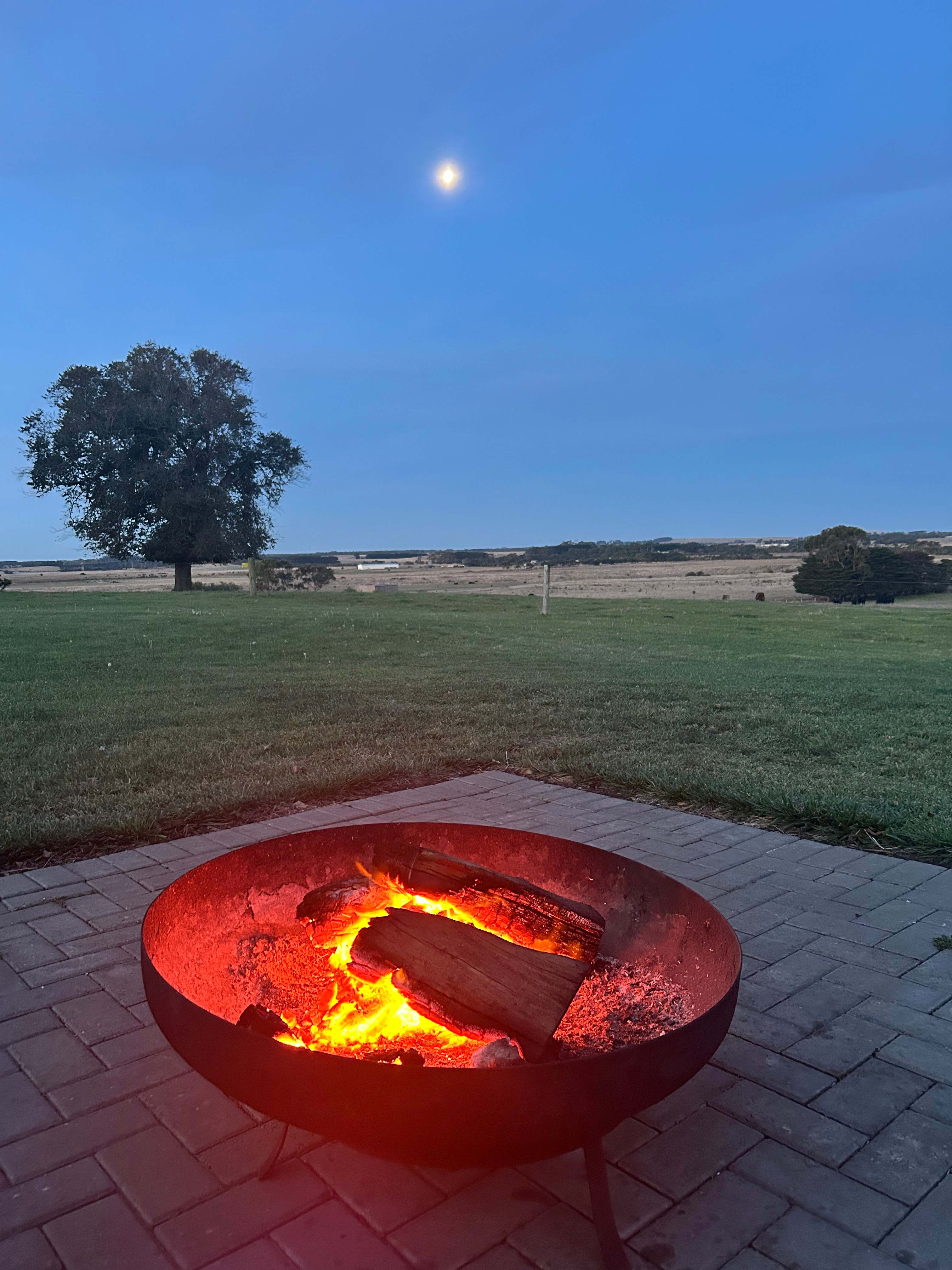 Moon rising over campfire