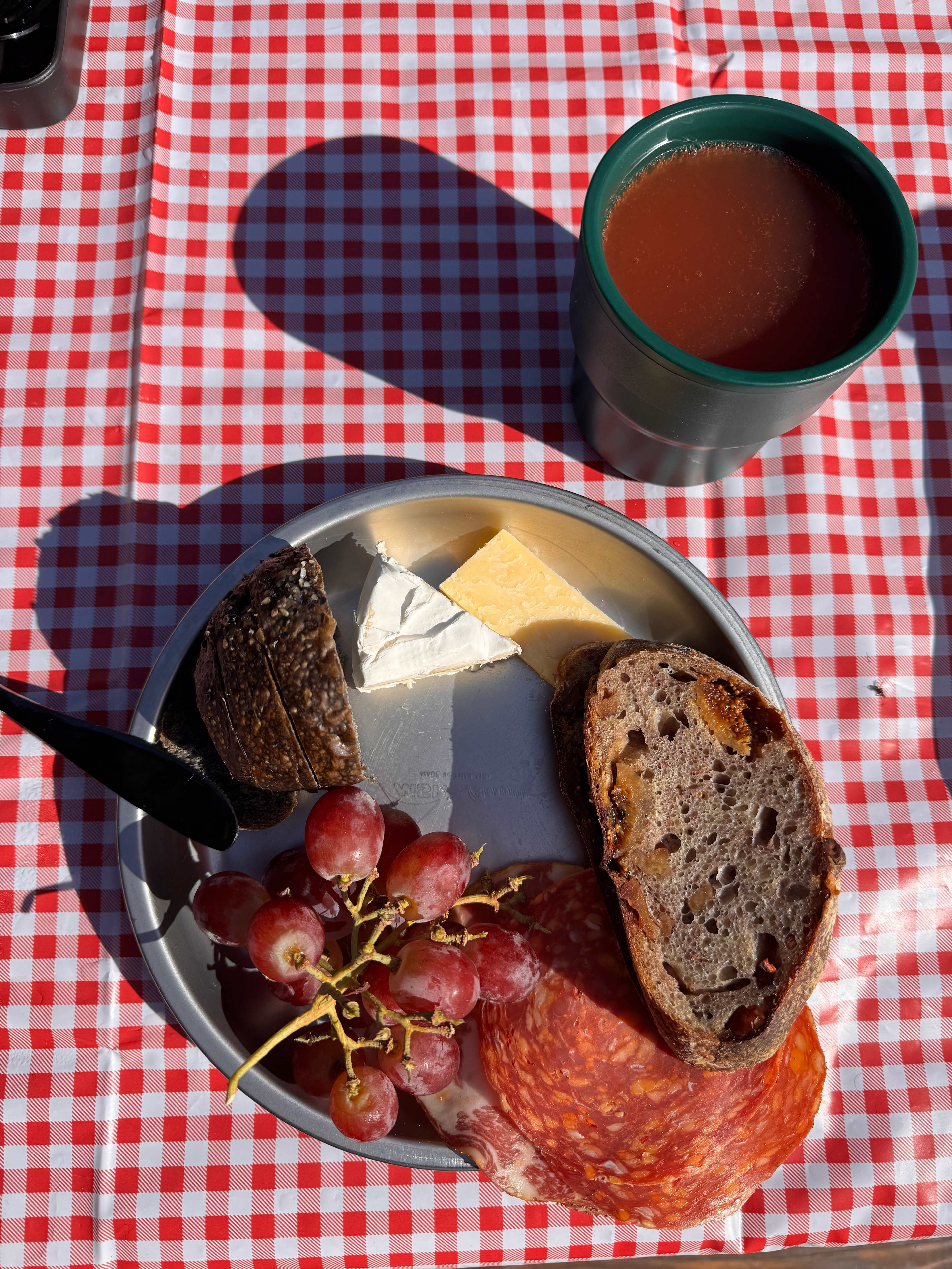 Breakfast of champs, michelada and local meats, cheeses and breads
